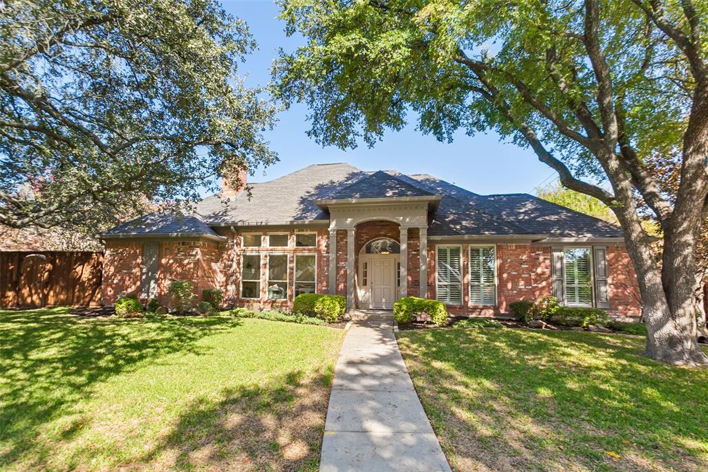 A Rare Far North Dallas custom home with a Private Resort-Style Backyard! Discover the exceptional charm of this sprawling one-story home, ideally situated on a premium .36-acre lot. Offering an incredible floor plan with a three-way bedroom split and a secluded primary suite, it's perfect for every stage of life. Freshly painted inside and out, the home features new carpet, luxury vinyl plank flooring, and a brand-new HVAC system. Additional recent improvements include the front door, high-end vinyl windows, a second AC condenser and beautiful landscaping. Natural light pours throughout the home, highlighting its gracious proportions and distinctive architectural details. The spacious kitchen is designed for both everyday living and entertaining, featuring absolute black granite countertops, a glass tile backsplash, double ovens, and an oversized pantry. The adjoining breakfast area includes a charming hutch, while the generously sized laundry room adds everyday convenience. A light-filled sunroom offers endless possibilities as a plant sanctuary, hobby room, home gym, playroom, or creative retreat. An elegant front living room welcomes guests, while the cozy rear family room features a wet bar for effortless entertaining. The private primary suite is a peaceful retreat, with doors and windows overlooking the spectacular resort-style backyard. Built just 10 years ago, the showstopping pool features a dramatic stone waterfall, a grotto, and a separate built-in hot tub. A covered pergola creates the ultimate outdoor gathering space, complete with a gas grill and mini-fridge. The expansive, fully enclosed yard offers abundant room for children, pets, and outdoor activities, while the electric gate provides an extra level of privacy and security. Additional covered parking and driveway space is available for extra vehicles, too. Enjoy the added benefit of an adjacent park and access to Plano ISD schools, including Plano West Senior High School.