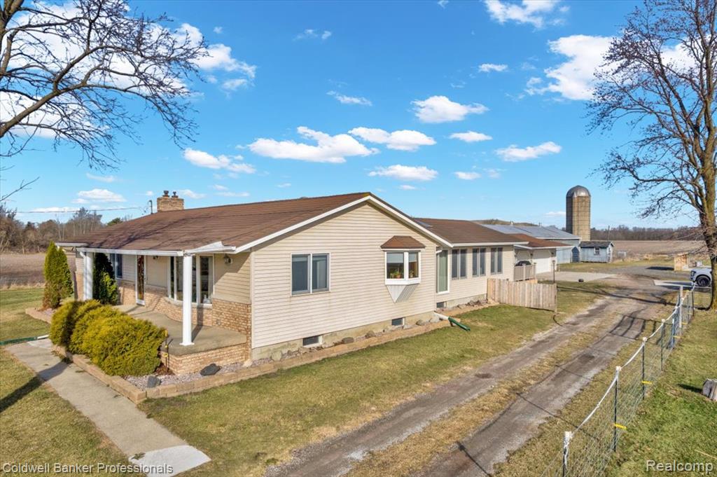 The Ultimate Michigan Country Estate in this 40-Acre Dream! Looking for the perfect blend of luxury, utility, and income? This stunning 40-acre property in Genesee County is ready for its next chapter. Whether you’re an equestrian enthusiast, a hobby farmer, or just someone who loves the peace of the Michigan countryside, this estate delivers on every level. Step into a meticulously maintained, freshly painted, 3-bedroom, 1-1/2 bath residence that balances classic charm with modern peace of mind. Stay cool with Central Air and cozy with a brand-new boiler powering efficient baseboard heat. Enjoy precision control with zoned thermostats throughout the home. Relax in the spacious sunroom, complete with its own Jacuzzi (20x32) —perfect for unwinding after a day on the land. Features a durable metal roof, new sump pumps, and a generator hookup so you’re never left in the dark. Dive into your heated swimming pool, professionally opened and closed for stress-free maintenance. Host summer BBQs on the large composite deck overlooking your sprawling 40-acre backyard. 3-Car Attached Garage (26x36): Features a new roof and built-in drainage and water pump, making it ideal for car enthusiasts or easy winter cleanups. A large barn equipped with horse stables and water pump (30x76), a 2-door pole barn (40x100) with concrete floor, plus a smaller raised outbuilding (12x24). This property is connected to NATURAL GAS—a rare and highly efficient find for large acreage in Michigan! What sets this property apart from any other on the market is the immediate financial benefit for the next owner. The land comes with an active year to year lease, with all proceeds transferring directly to the buyer and the option to extend into a future lease for long-term passive income. This is a unique opportunity to own a massive piece of the local landscape that actually pays you back while you enjoy the incredible lifestyle it offers.