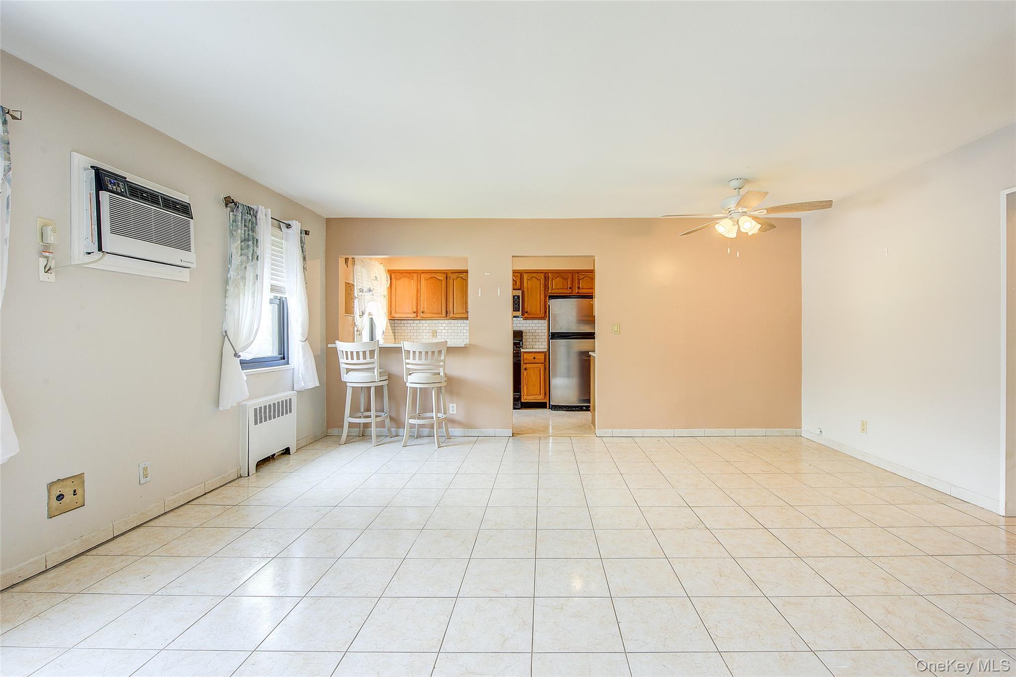 Renovated two-bedroom, one bath unit in the co-op community of Clearview Gardens. This spacious apartment has been recently renovated with tile floors and wood laminate in the bedrooms.  It has an updated kitchen, with light wood cabinets, quartz countertops, a tile backsplash and a pass-through breakfast bar.  The kitchen also includes an over-range microwave, a dishwasher and a stacked washer and dryer for convenience.  Both bedrooms are generously sized with lots of closet space and there are a total of 5 closets in the unit.  The windowed bathroom has floor-to-ceiling tiles and a full bathtub/shower. All doors in the unit are solid wood for a more elegant feel and the window treatments are included, as well as the 2 wall AC units and overhead ceiling fans.  This home is close to schools, shopping, restaurants and parks.  For transportation, highway access and 2 bridges are very nearby. The stop for the QM20 Express Bus to Manhattan is 2 blocks away and the Q76, (College Point to Jamaica) and Q61, (Beechhurst to Flushing) are only 1 block away.