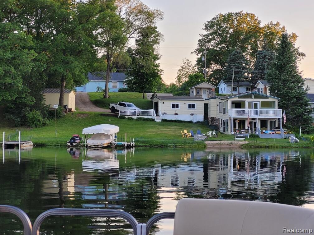 Wake up to the beauty of Crooked Lake in Garfield Township, where mornings begin with coffee by the water and evenings end with unforgettable Northern Michigan sunsets.This lakefront home sits on 124 feet of private frontage on Crooked Lake, a 264-acre, spring-fed all-sports lake for boating, swimming, and fishing in the summer—and ice fishing and peaceful winter views when the lake freezes.The home has approximately 1800 square feet of living space, featuring two bedrooms plus a  room used as a third bedroom and one and a half baths,for family, guests, or weekend escapes.Enjoy your own private beach giving you direct access to lake life year-round.Recent updates include new windows, flooring, a remodeled kitchen, and updated bathroom, with natural gas wall furnaces and three mini-splits providing efficient heating and cooling.