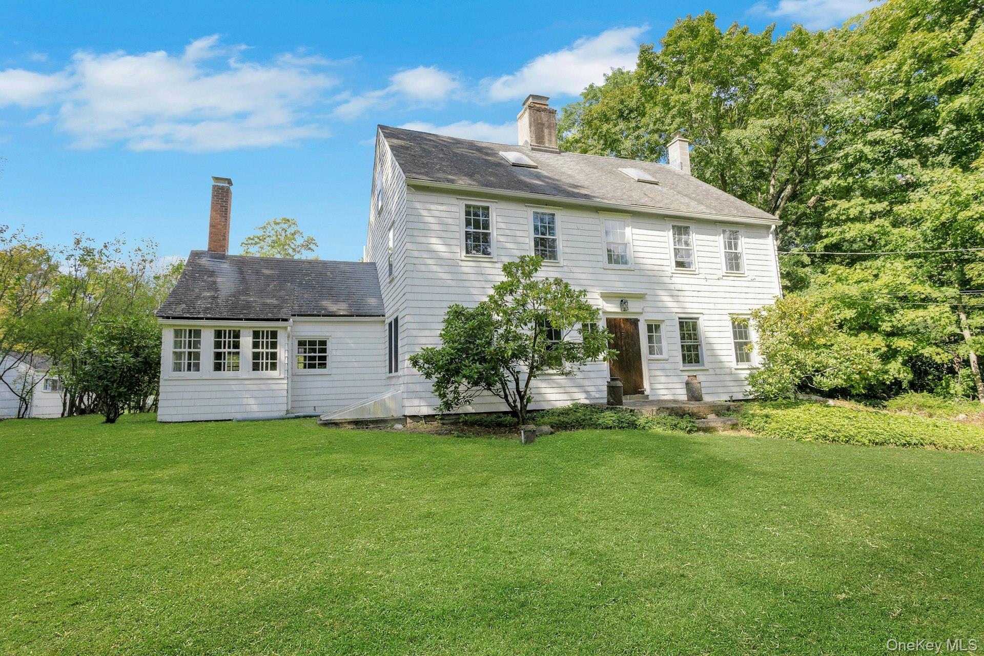 "The Rockwell House: circa 1794. Meticulously maintained Center-Hall Colonial w/large rooms and family floor plan + two outbuildings. Revolutionary-era architecture w/distinctive design features. Wide plank wood floors, period woodwork, detailed moldings, and 3 working fireplaces. Den/Office has a separate entry ideal for home office for those who need privacy while working from home. Stainless steel kitchen appliances to include:  Frigidaire Gas Range, Sub-Zero Refrigerator/Freezer, Bosch Dishwasher, plus  Asko Washer/Dryer and Fujitsu A/C units. Beautiful/Peaceful setting w/open land and antique stone walls. Walk to village amenities, especially HART shuttle bus for easy access to Katonah Metro North RR into Manhattan.