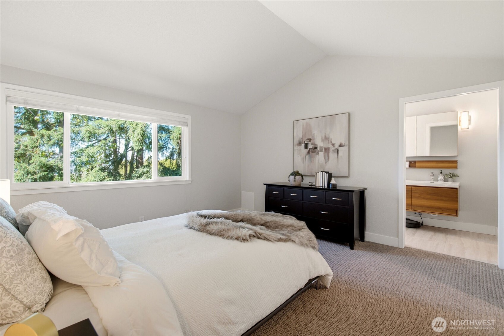 Comfortable primary suite offering a spacious layout and an ensuite bathroom.