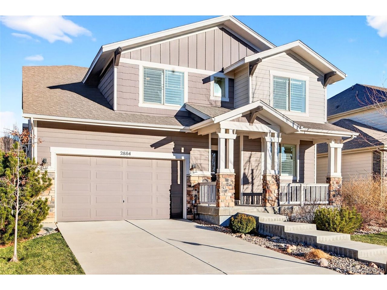 This beautifully designed 4-bedroom, 4-bath home offers custom finishes, thoughtful spaces, and access to exceptional community amenities. A welcoming entry leads to a private main-floor study, ideal for work or quiet retreat. Down the hall, the family room is made for gathering, filled with natural light from the soaring two-story ceiling and centered around a cozy gas fireplace. The kitchen is a chef's dream with white cabinetry, double ovens, a large island with bar seating, and a sunny breakfast nook - perfectly open to the family room for effortless entertaining. A custom wood accent wall adds warmth and character to the dining room, while a spacious main-floor laundry and full bath add everyday convenience. Upstairs, the primary suite is a true retreat with a 5-piece bath, soaking tub, large shower, and walk-in closet with custom built-ins. Two additional bedrooms share a full bath, while a third enjoys its own en-suite 3/4 bath. Peekaboo mountain views and a charming reading nook complete the upper level. The unfinished basement offers endless potential and unlimited possibilities to create the basement of your dreams with four egress windows and a bathroom rough-in. Outside, enjoy professionally landscaped grounds, low-maintenance turf, and an expanded patio perfect for dining and play. A 3-car garage - currently configured with a generous mudroom - adds flexibility. Located in the Lakes at Centerra, this home offers access to trails, lakes, clubhouse amenities, kayaks, community events, dog park, playgrounds, and easy access to all that Loveland has to offer. Homeowners in this neighborhood also have the option to choice into Fort Collins schools!
