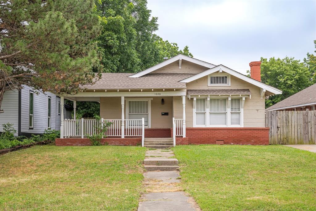 Updated 1921 bungalow in Oklahoma City's urban core, minutes from the Plaza District, Asian District, and the Classen and Western corridors. Covered front porch with brick base. Refreshed interior with neutral paint and luxury vinyl plank flooring throughout. Updated kitchen with white shaker cabinets, subway tile backsplash, and stainless steel appliances. Updated bath with tub and shower surround and vanity. Two bedrooms, one bath, 1,234 square feet on a deep fenced lot with mature trees and a detached one-car garage. One bedroom features a built-in window seat. Interior utility room with washer and dryer hookups. Seller is an inactive licensed real estate professional. Buyer and buyer's agent to verify all measurements, schools, and features. Showings scheduled via ShowingTime.