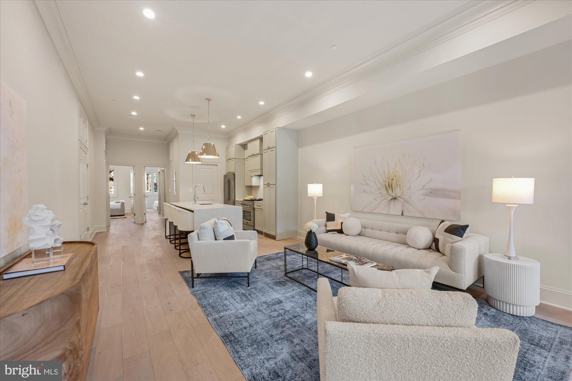 Welcome to The Mayfair Residences, a new construction 22-unit boutique building located at – 1335 11th Street NW. Residence #203 is a luxurious 2BD/2BA offering 1,134 SQFT of stunning open living space and private outdoor space. Highlighted by 11' ceilings, 7” wide-plank white oak floors, intelligent home technology, integrated surround sound system, and Anderson dual pane windows that flood this home with natural light while preserving superior sound insulation.Revel in the gourmet kitchen of your dreams. Miraggio cove quartz polished waterfall islands blend seamlessly with each design element – from the shaker style cabinetry to every touchpoint of the European plank hardware stimulating your senses with just the slightest of details. Accentuated by a luxurious FORNO appliance package, this kitchen truly personifies “home is where the heart is.”Developed by seasoned experts with over 20 years of experience specializing in Washington, D.C. historic preservation, and in close collaboration with Boxwood Design, this prestigious development draws inspiration from London's illustrious Mayfair District, blending classic elegance with contemporary sophistication. Offering a limited collection of 20 exquisitely designed homes, each residence is a testament to timeless style and unparalleled craftsmanship. Enjoy the convenience of urban life where world-class dining, boutique shopping, and iconic cultural institutions are just steps from your front door. Discover Logan Circle’s newest and next best opportunity at The Mayfair Residences – where classic distinction meets modern luxury. **Photos display model unit 204**