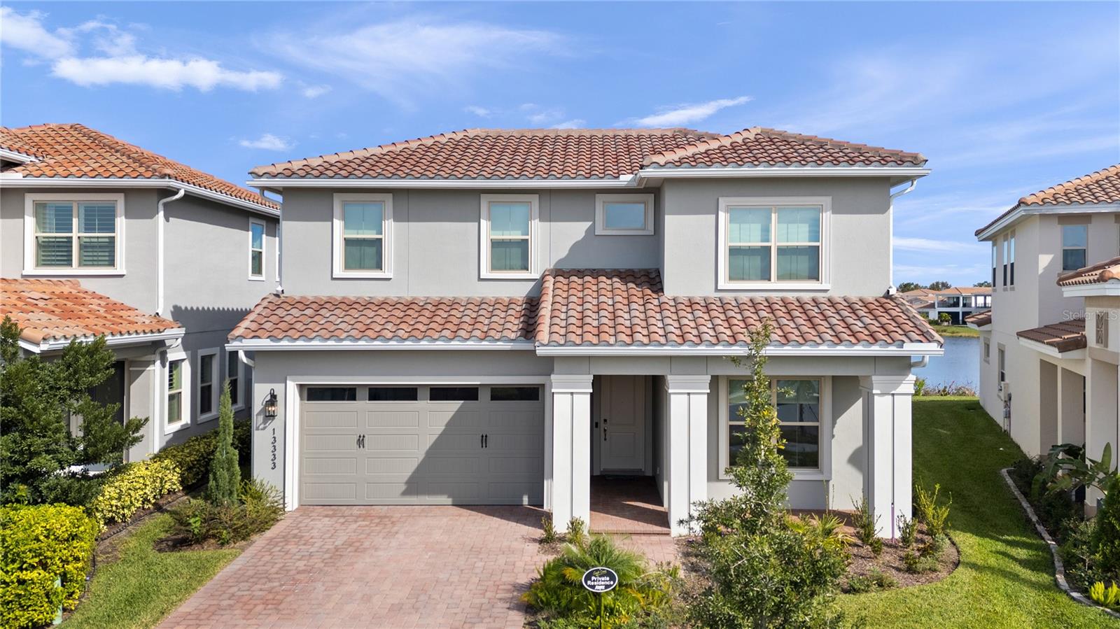 One or more photo(s) has been virtually staged. NEW $50,000 Price ADJUSTMENT!!!Priced Below Market Value! NO CDD! Situated in the Master Planned GATED GOLF Community of Eagle Creek. Explore the Epitome of Luxury Living in Lake Nona with this Modern Two-Level Home, spanning over 3700 square feet of living space; boasting FIVE spacious bedrooms, FIVE FULL Bathrooms, and a Gourmet Kitchen designed for the Culinary Enthusiast. The Master Suite is strategically situated on the ground floor for privacy and convenience. This Oakmont floor plan offers a huge Master walk-in closet with 2 entries, one off the large laundry room, the other leading into the Master Bedroom. The open-concept floor plan includes a generous dining/family room combination with glass sliding glass doors that open to a covered patio, offering views of the pond. Upstairs, the 5th Bedroom features another glass sliding door to a large walk-out balcony, and en-suite bathroom. Upstairs there is a large media room/flex room that you can create a Theatre room or game room perfect for entertaining.  Immerse yourself in resort-style amenities within a vibrant community, all located mere minutes from Orlando International Airport, the VA Hospital, and Lake Nona's Medical City. With easy access to shopping, dining, premier healthcare, and entertainment, this property melds modern comfort with an exceptional lifestyle.
The residence is a stone's throw from the community's 18-hole golf course, in addition you have access to top-tier amenities such as a fitness center, pool, tennis courts, and playgrounds. Plus, you're just minutes from Orlando International Airport and a brief 25-minute drive from world-renowned attractions like Walt Disney World and Universal Studios. This home is a harmonious fusion of luxury and lifestyle. Book your private tour today and see for yourself how your dreams of resort-style living can come true.