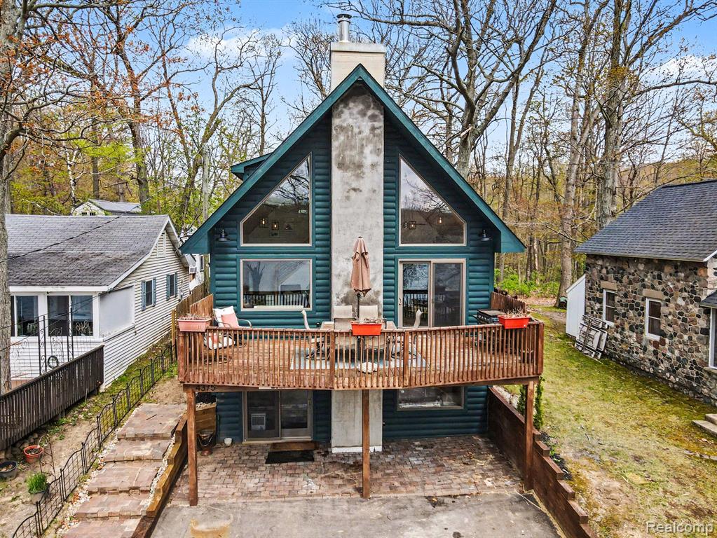 Great opportunity on this log sided four bedroom home on Skinner Lake.  This home was originally built in 2009 but has been completely updated in the last 5 years.  The interior has an incredible open layout.  Two story great room with a fireplace, vaulted knotty pine tongue and groove ceilings, and lots of windows overlooking the lake.  Large updated kitchen with quartz countertops and snack bar.  Two main floor bedrooms and a laundry room.  Upstairs is another family room and the primary bedroom with a fully renovated bath. In the walkout basement you will find an additional living room w/wood stove, bedroom, and utility room.  There is a large deck off the main floor that is perfect for watching the sun set over the lake.  Skinner Lake is a private 65 acre electric motor only lake that is great for fishing, swimming, and other water activities.