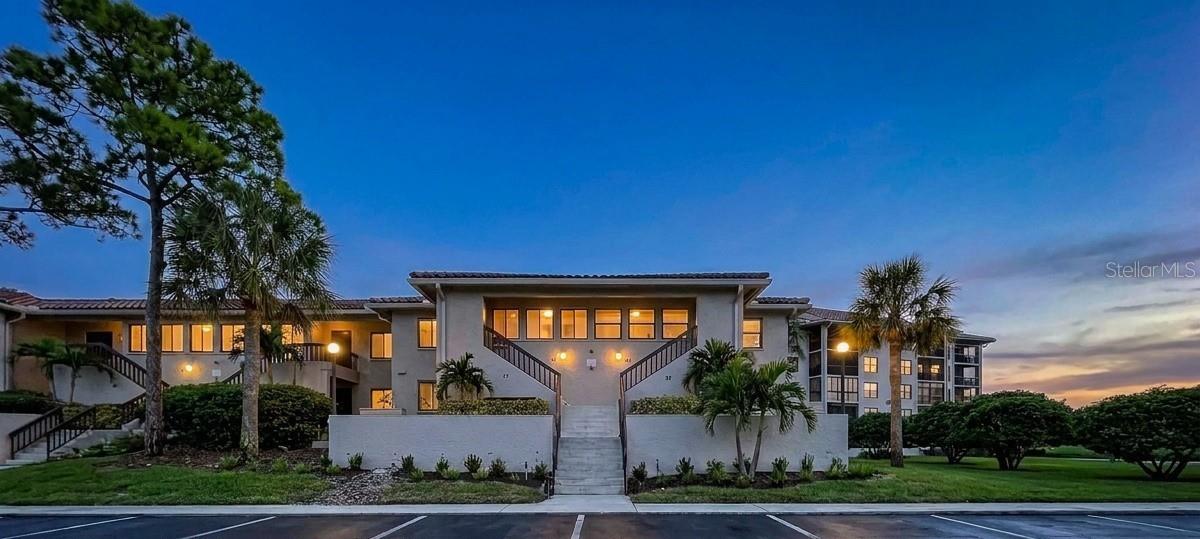 Virtually Staged. Discover a serene coastal sanctuary nestled within one of Tarpon Springs’ premier waterfront communities. This beautifully appointed residence features 2 bedrooms and 2 bathrooms, offering a rare blend of tranquility and effortless Florida living. Step inside to a bright, airy interior filled with soft natural light and timeless finishes. The open living area flows seamlessly, creating an inviting atmosphere perfect for quiet mornings, relaxed evenings, or intimate gatherings. The beautifully designed kitchen anchors the home with both style and functionality, while the private bedrooms — each with its own en suite bathroom — feature restful settings designed for relaxation and everyday comfort. The residence features hurricane impact windows and a coastal grade sliding doors to enhance safety, efficiency, and long-term value. The community offers the peace and prestige of 24-hour guard gated security, setting the tone for a refined coastal lifestyle. A private marina awaits just beyond the gates, where boat slips are available for rent on a first come, first served basis, creating effortless access to the water. Residents enjoy an impressive collection of resort style amenities, including kayak storage, two heated pools, a beautifully appointed clubhouse, fitness center, jacuzzi, tennis and pickleball courts, a fishing dock, and a scenic waterfront walking trail. For added convenience, an on site EV charging station is located near the clubhouse. The quarterly HOA fee delivers exceptional value, covering cable, internet, water, sewer, trash, pool maintenance, exterior building maintenance, groundskeeping, exterior pest control, property management, escrow reserves, common area taxes, 24 hour guard service, and private roads. Whether you’re enjoying sunrise walks, sunset views, or the vibrant coastal culture of Tarpon Springs, every day feels like a getaway. Perfectly situated near marinas, beaches, boutique dining, and the historic Sponge Docks, this home delivers the ideal blend of luxury, convenience, and Florida charm. For buyers seeking a lock and leave residence with upscale appeal, this property offers an exceptional opportunity to own a piece of the Gulf Coast’s most treasured shoreline.