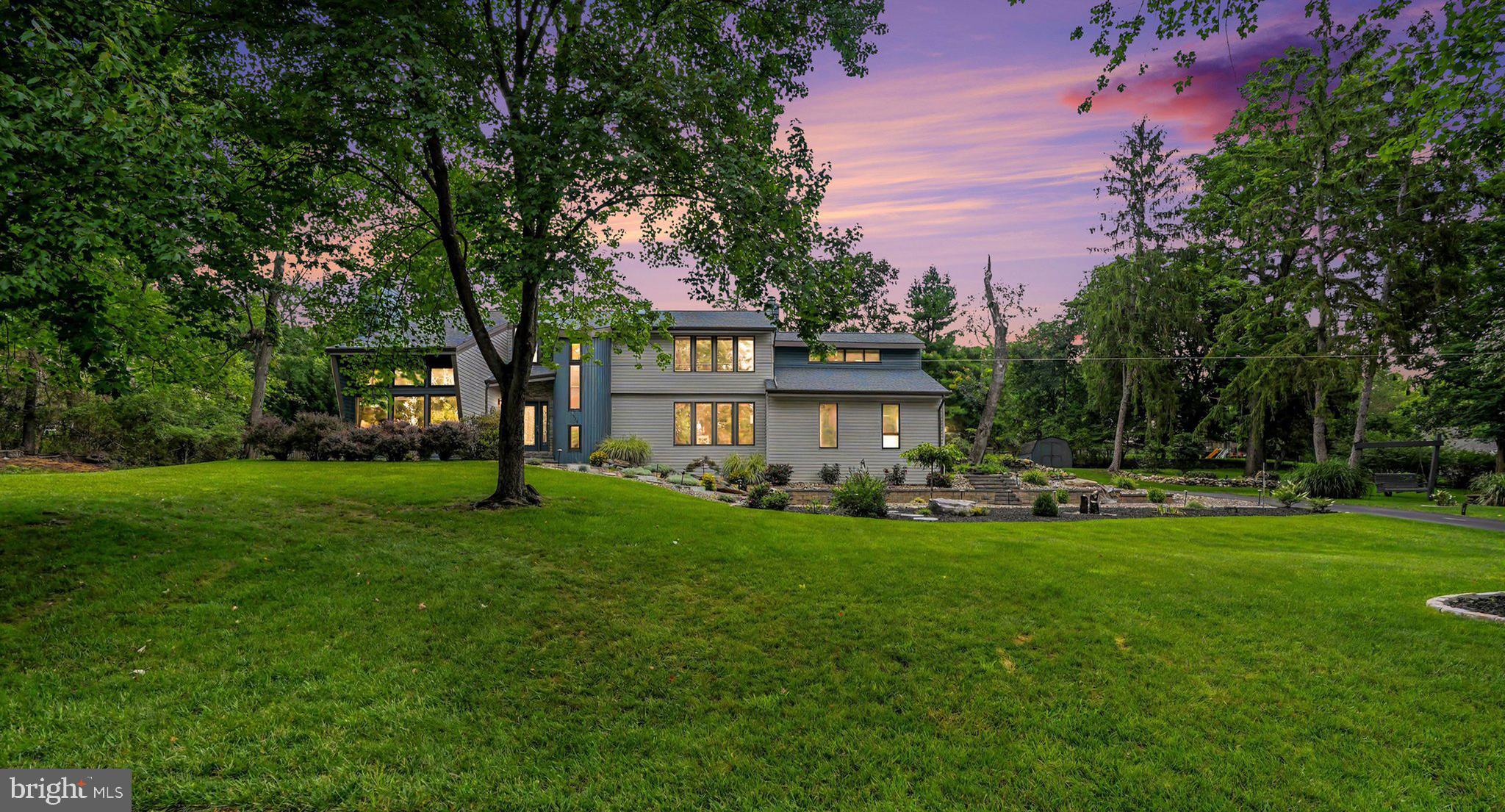 4076 Rosewall Court, Harrisburg, PA 17112 Forest Hills Community. Tucked away on apremium cul-de-sac lot in the prestigious Forest Hills community, this majestic customcontemporary two-story home offers endless mountain and wildlife views in a truly privatesetting. From the moment you arrive, the incredible landscaping, extensive hardscaping withfirepit, and the soothing sound of peaceful water features create one-of-a-kind curb appeal thatsets this property apart. Step through the inviting formal entry with hardwood floors and aconvenient guest closet, and you’ll immediately sense this is a special place to call home. Theopen living room features soaring vaulted ceilings, large windows that flood the space withnatural light, and the warmth of a stone wood-burning fireplace with a wood mantel. Just off theliving room, the formal dining area opens through French doors to a screened-in rear porchcomplete with vaulted ceilings, a ceiling fan, four skylights, and direct access to a compositewood deck overlooking your private rear oasis. The gourmet kitchen is a true showpiece,offering recessed lighting, solid wood cabinetry, granite countertops with a breakfast bar, and acustom built-in desk, and a stainless-steel appliance package. It flows seamlessly into a casualdining area and family room anchored by a breathtaking stone fireplace, with easy access to therear yard. Also, on the first floor you’ll find a bedroom, a full bathroom with an enclosedshower, and a laundry/mudroom complete with washer and dryer. Upstairs, the second floordelivers even more surprises. A loft with a large custom triple window with skylights creates aperfect spot to kick back and take in the stars. The primary bedroom suite impresses with agenerous bonus area ideal for a private getaway, office, or dressing room. The primary bedroomitself features a walk-in closet with a custom built-in dresser topped in ceramic tile, a woodburningfireplace, skylights, and access to a luxurious primary bath with ceramic tile flooring, adouble-basin vanity with granite top, a low-profile step-in shower, and a corner soaking tub.Three additional well-sized bedrooms share a main bathroom featuring a double-basin vanitywith custom built-in slide-out step stools, a tub/shower combination, and a large hallway linencloset. The lower level expands the living space with a family room, powder room, and two hugestorage rooms. With numerous updates like a new roof, new flooring, new siding , electric fence, and an exceptional location, this home is a rare opportunity to enjoy privacy, quality craftsmanship, and natural beauty in one of the area’s most desirable communities.