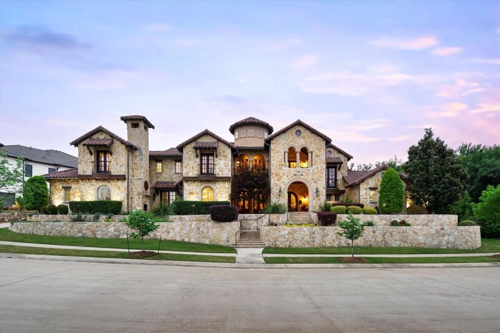 Presenting the breathtaking elegance of this stunning Tuscan architectural home offers magnificent views of the golf course & lush greenbelt. This 7,000 sq ft masterpiece showcases incredible curb appeal with its exquisite stone-stucco façade, graceful arches & elegant balconies. With 5 bedrooms, 5 full, 2 half baths, a library, game room, media room & a luxurious 4-car garage, this home evokes the timeless charm of Old-World EuropeEnter through the soaring foyer & be captivated by the wrought-iron staircase & meticulously plastered walls, an elegant dining room, while a fantastic 1,500-bottle temperature-controlled wine cellar sets the perfect tone for wine enthusiasts.The chef’s kitchen is a culinary paradise, featuring high-end Sub-Zero and Wolf appliances, granite countertops, a serving bar & a sunny nook alongside a butler's pantry, expansive wet bar & beverage areas, making entertaining a breeze. The exceptional family room, with its vaulted ceiling adorned with rustic beams, a cozy cast stone fireplace, graciously connects to an expansive veranda & pool area for seamless indoor-outdoor living.The exquisite master suite with a lovely sitting area & a spa-like bath featuring elegant granite vanities, travertine flooring & a spacious WIC.First floor also includes a state-of-the-art THX media room, a guest suite & a library. The upstairs area boasts a sprawling game room & 3 bedroom suites with private balconies—a charming treehouse with a spiral staircase—perfect for a kid's hideawayStep outside to a massive wrap-around veranda that is an entertainer’s dream, featuring a BBQ area, alfresco dining space & a comfortable lounging area with an outdoor fireplace, heaters & fans, all overlooking a spectacular pool, relaxing spa & beautifully landscaped grounds. With extensive paver decking, travertine floors, & an immaculate putting green. Impressive laundry-craft room combo. Two staircases, a hidden safe room, extensive hand-scrapped wood floors & mud room.