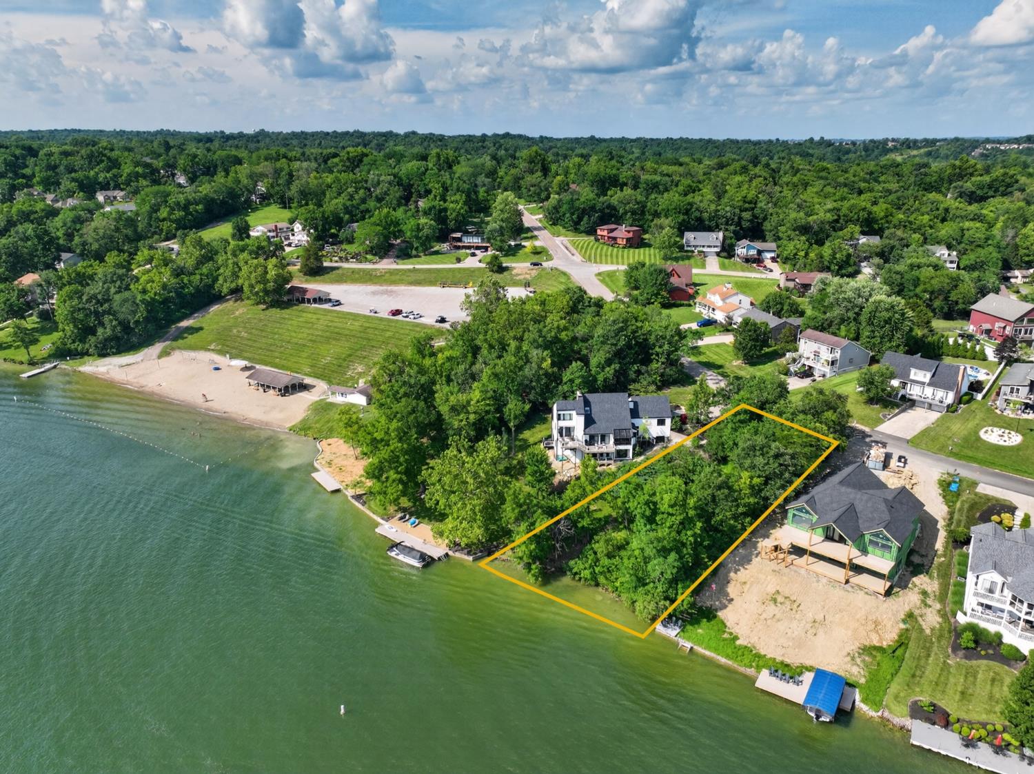 Want to live on the lake but prefer to build your dream home? Here's your chance! Oversized lakefront lot located on the widest part of Hidden Valley's main lake, this property offers a gentle slope from the street to the water, with a large buildable area, stone seawall with over 105 ft of water frontage, and the potential for a flat or gently sloping driveway like the house next door! Enjoy panoramic water views as well as beautiful sunset views from your deck or dock, and a longer sun exposure than the opposite side of the lake. Deep water for swimming, boating or just relaxing.  No usage limitations here like at the ends of the fingers! Sewer line easement runs along the shoreline at the rear of the lot. Lot lines shown are approximate - survey stakes mark actual lot lines. Take advantage of this opportunity and start enjoying the water from your own home-site when the season opens!