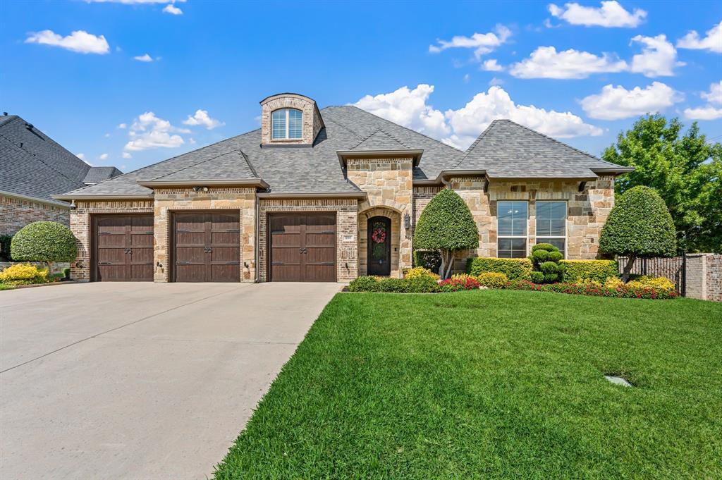 Nestled on one of the most desirable streets in Colleyville, this impressive 4 bed, 3.5 bath ONE LEVEL home offers 3,154 SF of easy luxury living. Loaded with architectural details, you will feel the quality of this custom-built first time on the market since being built home upon entering the iron and glass front door. Notice timeless details like real hand-scraped hardwood floors, built-ins, wainscoting, encased windows, stonework, arched doorways and ceilings, coffered ceilings, wood shutters-too many features and upgrades to fit this space! (See list in Transaction Desk) The separate dining area has a built-in sideboard and custom dry bar for your favorite collection and glassware. Boasting granite tops, large island, stainless appliances, double ovens, wine cooler, 6-burner gas range and an abundance of work space, the kitchen is a culinary happy place. Kitchen opens to high ceilings, stone fireplace, and custom built-ins and bookcase in the living area. Very functional split bedroom floorplan. The primary suite is an outstanding place to start and end the day with generous sleep space, granite, soaker tub, separate shower, and huge custom closet. Retreat to your media room for game day or movies. Step outside to premium outdoor living with a covered porch, outdoor kitchen overlooking the sights and sounds of your heated saltwater pool & spa. Waterfalls, cabana, stone fireplace, beautiful landscaping and accent lighting create your personal oasis. 3-car garage with epoxy flooring, cabinet storage and slatwall included. No doubt this home was carefully maintained and it shows. 1 yr oldCLASS 4 roof, updated HVAC, updated & automated pool equipment and more! There's quality inside the walls also--integrated fire suppression system, BASE battery backup (no power outages), upgraded power panel with surge protection. Past homes sold on this street have attracted strong demand, so don't miss your chance to make it yours!