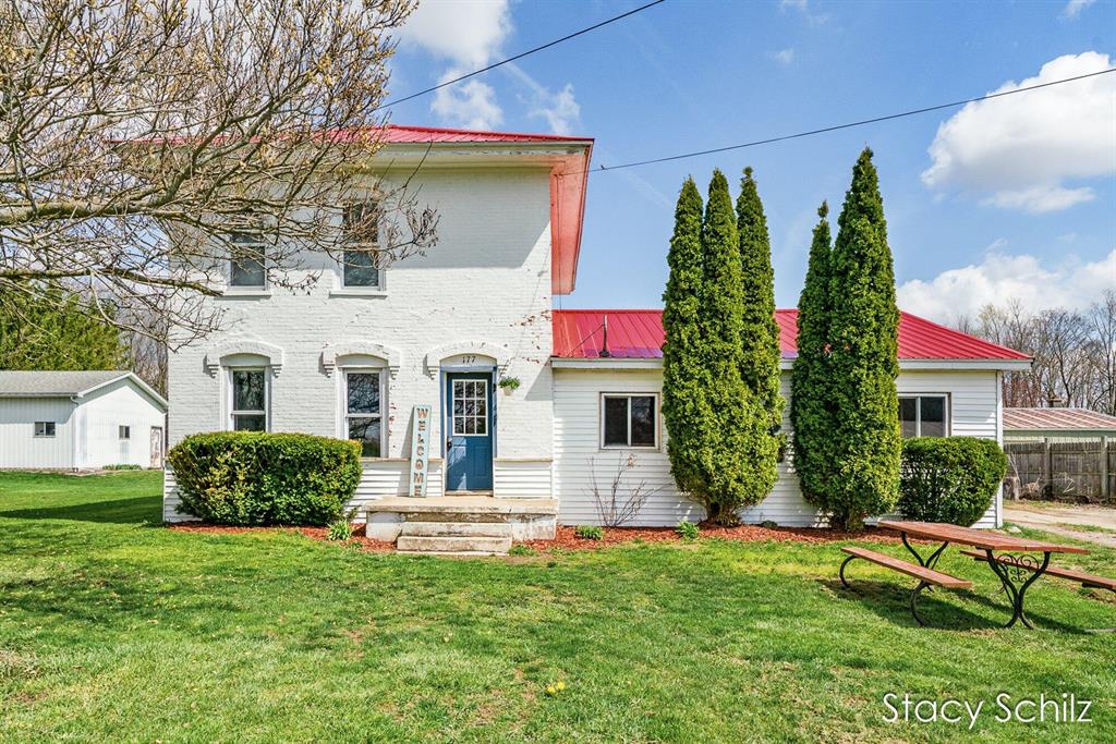 Nestled in the quant village of Vermontville is this spacious brick home sitting on a generous half-acre lot. Step inside to find a versatile layout featuring 4 bedrooms, including one on the main or use it as an office or huge pantry/storage room, 2 full baths (one on each level) with main floor laundry.  Outside you will find a 2-stall attached garage with a third stall great for lawn equipment and extra storage.  The expansive yard offers endless possibilities for gardening, entertaining, recreation or simply relaxing.  Major updates provide peace of mind, including a brand new furnace, newer metal roof, and tankless water heater for energy efficiency and long-term savings.  Home also boasts new carpet in the living room.  Just minutes from schools, dining, the park, and the Paul Henry-Thornapple Trail perfect for walking, biking and enjoying the outdoors.