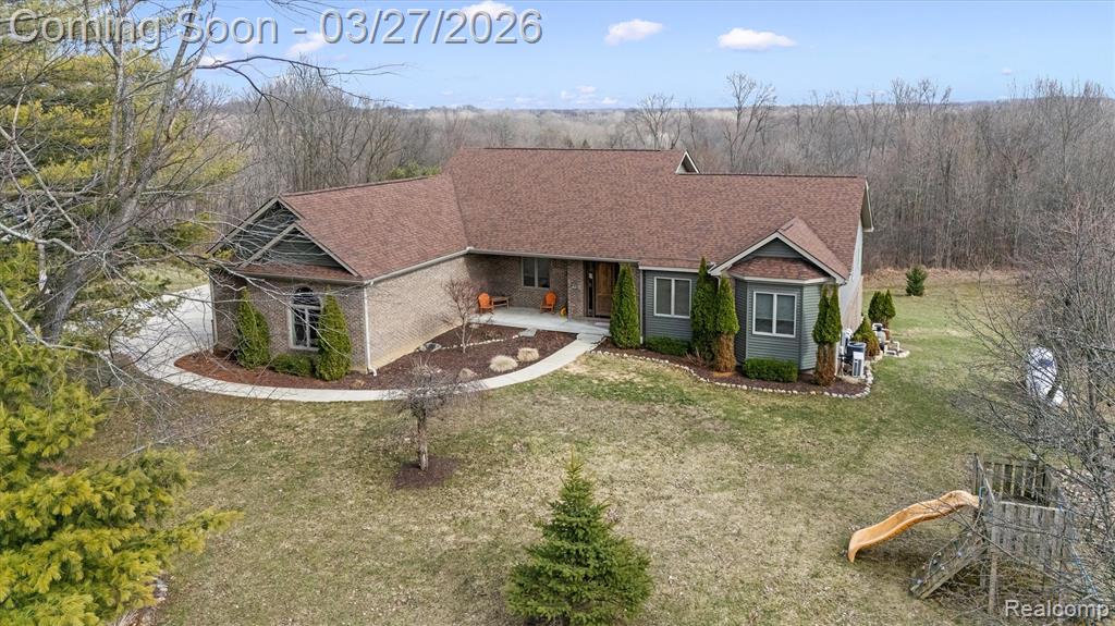 Stunning newer-built ranch set on over 10 private acres, offering the perfect blend of comfort, quality, and space. Built in 2019, this 3-bedroom, 2.5 bath home features an open-concept layout with a spacious living room highlighted by a gas fireplace and expansive windows that bring in natural light and scenic views. The kitchen is beautifully appointed with quartz countertops, custom cabinetry, and under-cabinet lighting, flowing seamlessly into the dining area and living space—ideal for everyday living and entertaining. Just off the main living area, enjoy a 24x12 covered deck overlooking the private backyard, wooded setting, and heated in-ground pool. The primary suite offers a true retreat with a spacious layout and a private bath featuring dual sinks and a relaxing air bubble tub—perfect for unwinding at the end of the day. Additional bedrooms provide flexibility for guests, office space, or hobbies. The unfinished walkout basement is filled with natural light thanks to numerous windows and is already plumbed for a future bathroom—offering incredible potential for added living space. Both the basement and attached 2-car garage feature heated floors for year-round comfort.Outside, the property continues to impress with a partially heated pole barn equipped with water and a garage door opener—perfect for storage, hobbies, or workspace. This property delivers privacy, functionality, and modern convenience—all in a beautiful natural setting.