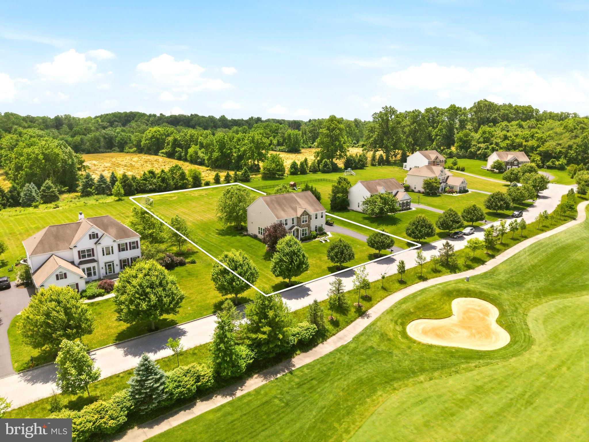 Welcome to 461 Norland Drive, beautifully positioned within the prestigious Applecross community of Downingtown, where luxury living and breathtaking views come together in perfect harmony. Located on the only street in the community with direct, front-facing golf course views, this exceptional home enjoys unobstructed vistas of both the 16th and 17th holes.Imagine starting your morning with a cup of coffee as the sun rises over the fairways, listening to the birds and watching golfers make their approach to the 16th green or tee off on the 17th. It's the kind of view that never gets old and feels more like a private resort than a neighborhood.What makes this homesite truly special is the contrast it offers. Sweeping golf course views and open green space stretch across the front of the property, while the rear backs to more than an acre of picturesque Chester County countryside, creating a sense of privacy and tranquility that is increasingly hard to find.Whether you're relaxing on the expansive deck, dining al fresco beneath the covered porch, or simply taking in the scenery from inside, every space is designed to showcase this extraordinary setting.A dramatic two-story foyer welcomes you inside, where rich hardwood floors extend throughout the main level. Flanking the foyer are a private office with French doors and an elegant formal living room that flows seamlessly into the formal dining room, creating the perfect setting for entertaining.At the heart of the home is a spectacular gourmet kitchen, completely redesigned in 2023. Designed to impress, it features a sprawling 13-foot center island with seating for six, a 60-inch Thermador gas range, built-in Thermador microwave drawer, Fisher & Paykel double dishwasher, Sub-Zero refrigerator and wine fridge, quartz countertops, designer tile backsplash, and custom ceiling-height cabinetry with integrated outlets.The kitchen opens to the spacious family room and provides direct access to the deck and covered porch, where panoramic views of the private backyard create a stunning backdrop for everyday living. With ample room for a future pool or outdoor entertaining oasis, the possibilities are endless.Upstairs, the primary suite serves as a private retreat with a spacious sitting room and a spa-inspired bath featuring a soaking tub, oversized shower with built-in seating, dual vanities, private water closet, and a large walk-in closet. A princess suite enjoys its own private bath, while two additional bedrooms share a Jack-and-Jill bath. A second-floor laundry room adds convenience.The fully finished walk-up basement adds more than 1,200 square feet of living space and was designed with entertaining in mind. Highlights include a custom kitchenette with quartz countertops, beverage fridge, kegerator, and live-edge bar overlooking the lounge area. A fifth bedroom and full bath make this level ideal for guests, multigenerational living, or a private in-law suite, with walk-up access offering the potential for a separate entrance.Recent updates include a whole-home generator (2023), new HVAC systems (2023), a newly finished basement (2025), and a tankless water heater with PEX plumbing manifold (2024).Beyond your doorstep, Applecross offers a true resort-style lifestyle, featuring a Nicklaus-designed golf course, fitness center, indoor and outdoor pools, pool bar, tennis courts, Studio T fitness and dance studio, restaurant and bar, and a vibrant calendar of social events. Combined with the award-winning Downingtown Area School District and convenient access to shopping, dining, parks, and major commuter routes, this exceptional property offers the perfect balance of luxury, lifestyle, and location.Opportunities to own on this coveted street are exceptionally rare. Applecross — Live Where You Play.