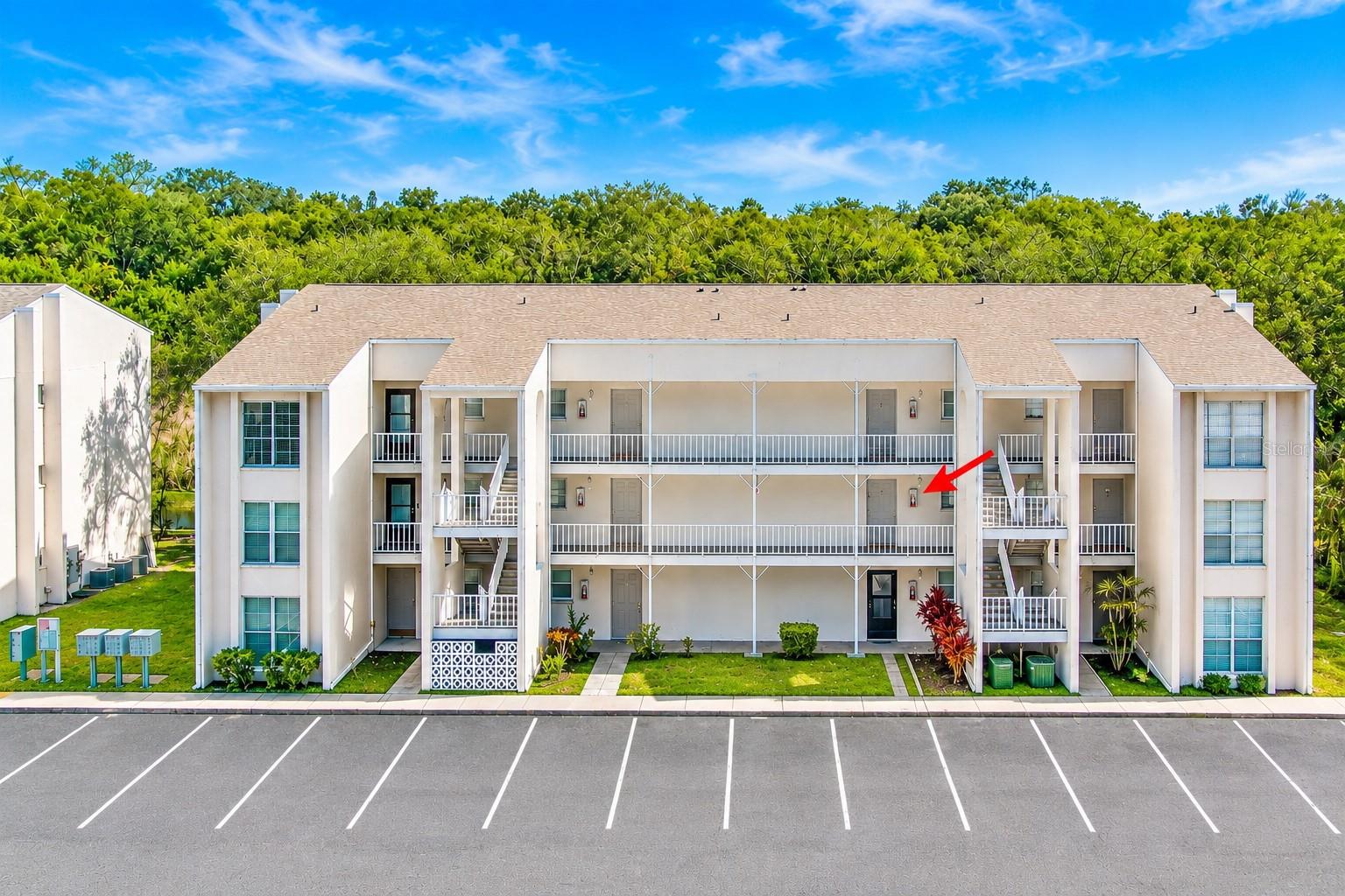Welcome to easy Florida living in this bright and inviting second-floor, 1-bedroom, 1-bath condo overlooking a peaceful pond in the heart of Clearwater. Offering comfortable living space just minutes from the Beaches, this strong block-and-stucco constructed residence has never flooded and combines low-maintenance with a practical, open layout filled with natural light.Inside, durable tile flooring flows throughout the main living areas, providing a clean, solid surface that is easy to maintain—perfect for everyday Florida living. The kitchen features warm solid-wood cabinetry, generous counter space and a convenient pass-through that keeps the kitchen connected to the dining and living areas. The open living and dining space feels bright and spacious, with plenty of flexibility for arranging your furniture and creating a comfortable place to relax or entertain.Step outside onto the private balcony overlooking the tranquil pond, where you can enjoy your morning coffee, watch the ducks and unwind in the evening with a peaceful water view. The combination of natural light, tile flooring, wood cabinetry and indoor-outdoor living gives the condo a warm, welcoming atmosphere.Coachman Creek offers a low-maintenance lifestyle with two community swimming pools, tennis courts and landscaped grounds. Nearby walking and biking trails and disc golf courses provide even more ways to enjoy the outdoors. The central Clearwater location places shopping, restaurants, malls, public transportation and everyday conveniences close at hand.Sports fans will appreciate being just minutes from BayCare Ballpark, spring-training home of the Philadelphia Phillies, while beach lovers can enjoy convenient access to world-famous Clearwater Beach and the Gulf Coast. Dunedin, Safety Harbor, downtown Clearwater and Tampa International Airport are also within easy reach.Whether you are searching for a primary residence, seasonal Florida retreat or comfortable, low-maintenance place to call home, this condo brings together practical interior features, peaceful pond views, two community pools, outdoor recreation and an exceptionally convenient Clearwater location. Come enjoy the comfort, convenience and classic Florida lifestyle this home has to offer.
