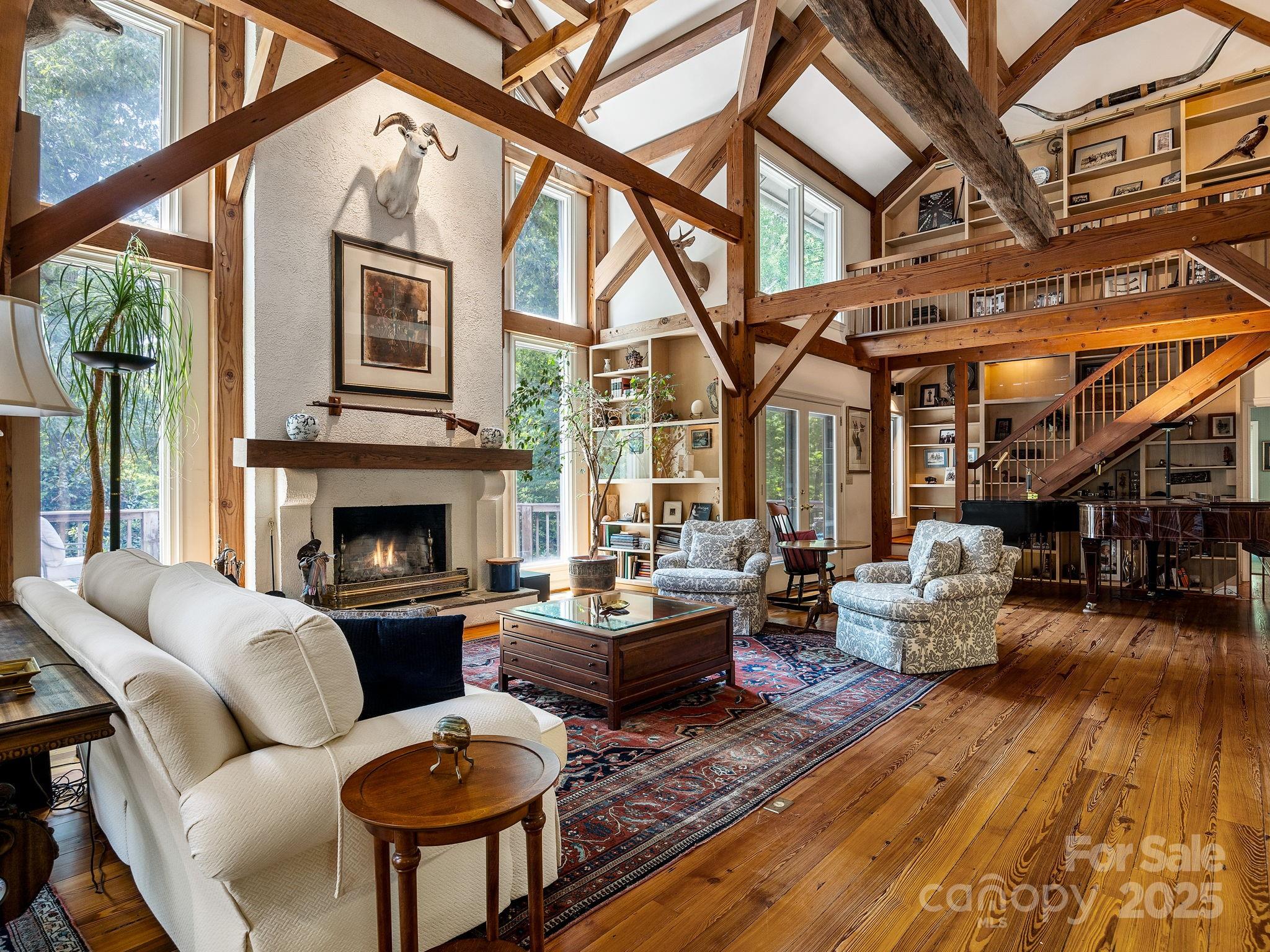 1360 Skunk Hollow Rd- For the buyer who values craftsmanship, privacy, and usable acreage—this is the one.Tucked into a peaceful, private setting, this 70 ± acre estate pairs a hand-hewn timber-frame home of more than 5,800 square feet with a guest cottage and a large creek-fed pond surrounded by rolling pasture and mature woods. Nearby, an excavated and leveled building site already has electricity in place—providing the infrastructure for future expansion, whether a barn, studio, or other purpose-built space. The seller is open to adjusting the acreage to suit the buyer’s vision.The main home offers three bedrooms, two baths, multiple fireplaces, generator, and an expansive upstairs with additional rooms and loft space—ideal for offices, guest quarters, or creative use. The guest cottage provides comfortable living space with two bedrooms and one bath, perfect for visitors, rental income, or on-site help.Every part of the property has been crafted with intention, offering flexibility and enduring quality. Whether you envision a private retreat, working farm, or equestrian property, this land is ready to support it.A rare opportunity to own a legacy property with the space, quality, and quiet beauty that are hard to find—and even harder to replicate.