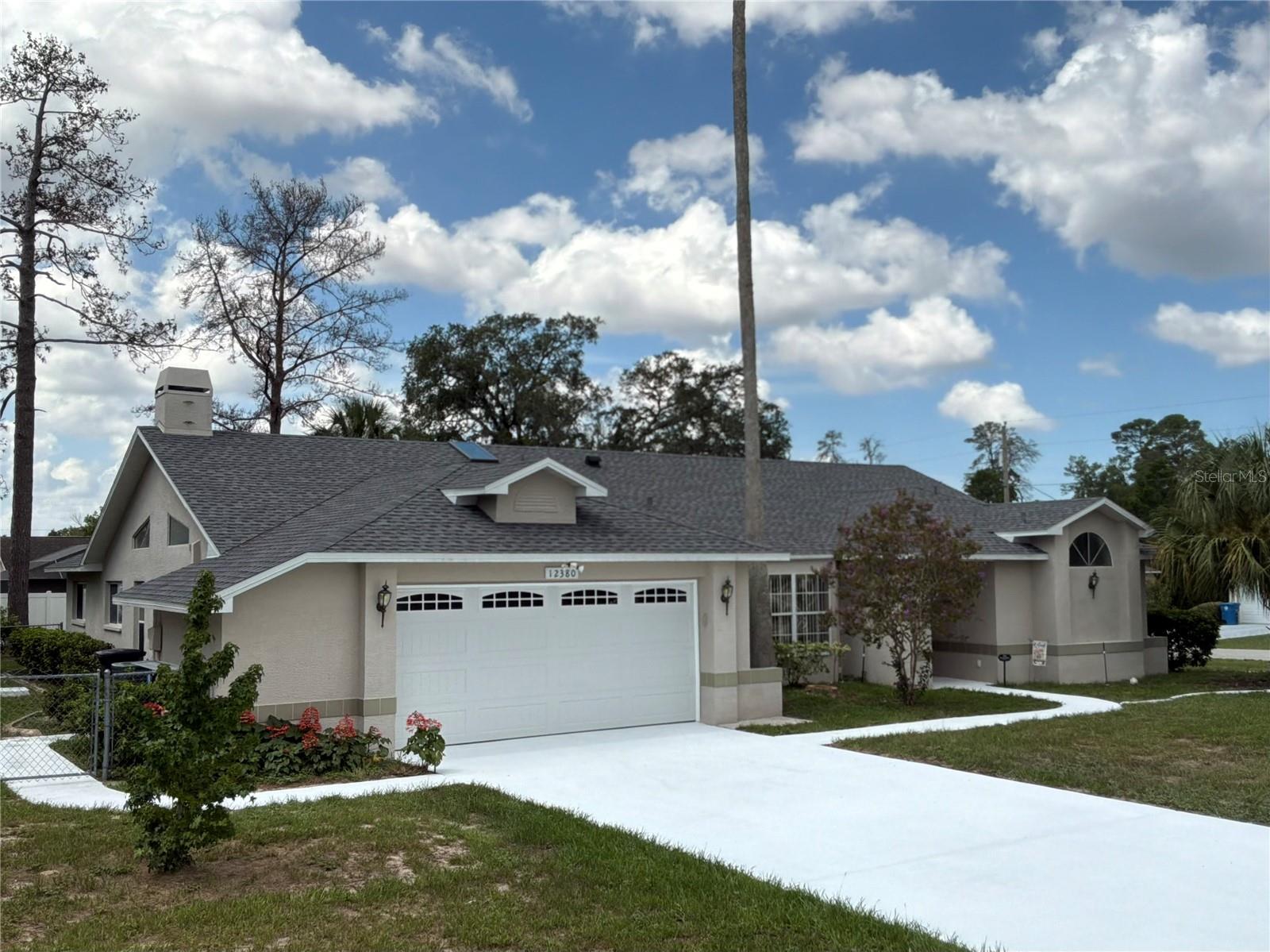 If you've been looking for a move-in ready pool home with the big-ticket updates already taken care of, this one deserves a closer look. Offering 4 bedrooms, 2 bathrooms, and 2,245 square feet of living space (3,059 total), this home combines generous living areas with the kind of maintenance history buyers appreciate. The family room centers around a wood-burning fireplace, creating a comfortable gathering space, while the screened in ground pool and covered lanai provides plenty of room to relax or entertain throughout the year.  A formal dining room and a separate living room provide flexibility if additional living space is needed.Over the past several years, the owners have made substantial improvements, including a new roof and skylights in 2025, HVAC replacement in 2022, new kitchen appliances including the refrigerator, range, microwave, and dishwasher in 2024, and both bathroom toilets replaced in 2024. The pool was resurfaced in 2021, a new pool pump was installed in April 2026, and the garage door was upgraded in 2014, and the water heater was replaced in 2013.  In 2026, the home also received the “third nail” upgrade on the truss tie-downs, helping to maximize available wind mitigation credits for homeowners insurance.Located in the heart of Spring Hill, and literally minutes from shopping, hospitals, and only 50 minutes to the Tampa Regional Airport, this well-maintained home offers the space, updates, features, and a very convenient location that are increasingly difficult to find in one package. Schedule your private showing before this opportunity is gone.