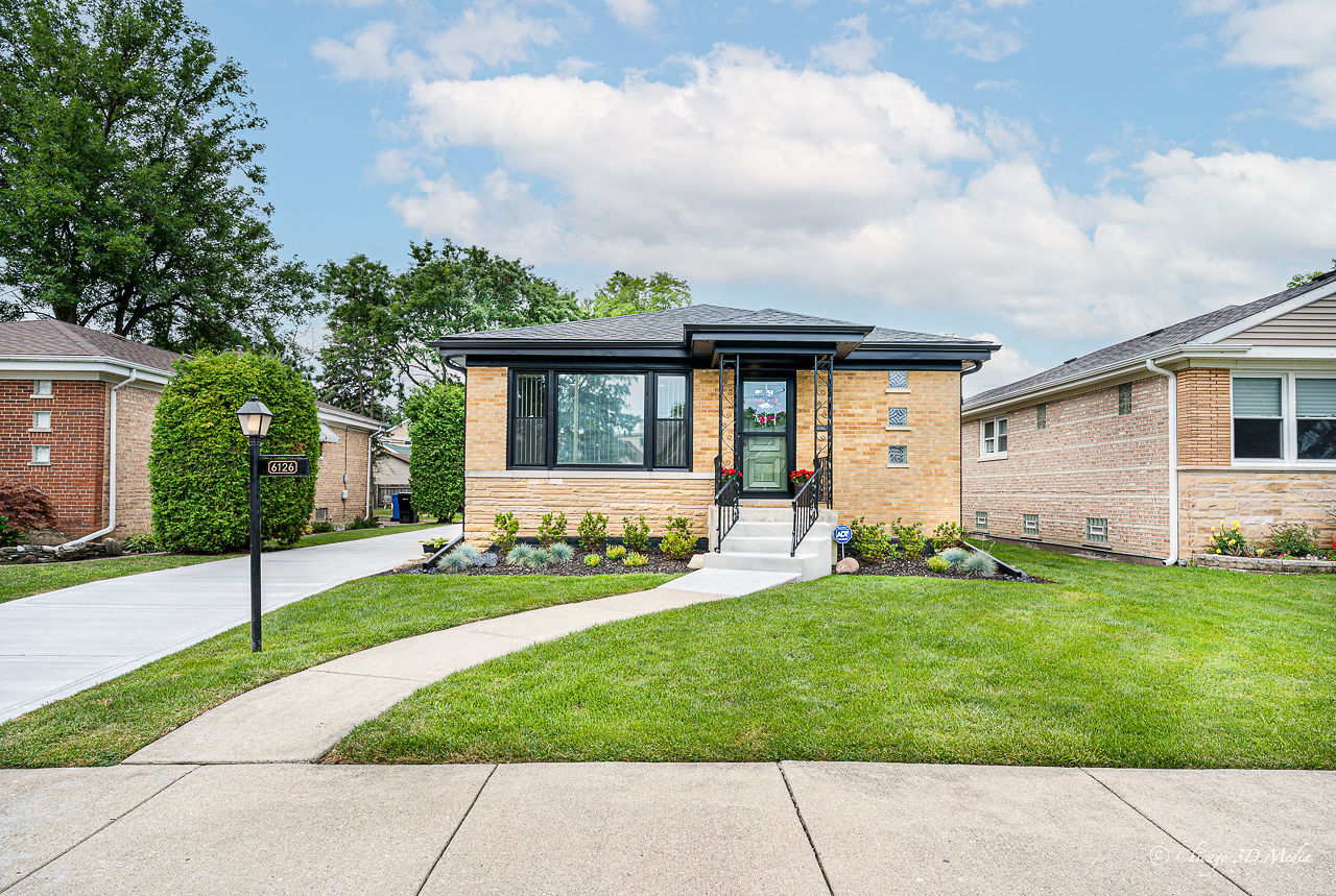 Discover the perfect blend of timeless charm and modern conveniences in this beautifully renovated brick ranch! Featuring 3 spacious bedrooms and 2 full baths, this home is move-in ready with major updates throughout: new tear-off roof; mostly new windows; new furnace, central A/C, water heater and copper plumbing; new concrete side drive and entry steps; and a completely rebuilt 2.5 car garage. Step into a modern eat-in-kitchen with new custom-made white cabinetry, quartz counter tops, ss appliances complimented with restored vintage details that gives the home character and warmth. The bathrooms have been thoughtfully redesigned with contemporary fixtures and style. Beautiful hardwood floors throughout. The full finished basement offers additional living space - ideal for entertaining and a home office with potential for adding a fourth bedroom.  Sliding door from the kitchen opens up to the cozy backyard deck perfect for your summer gatherings. Oh, did I mention oversized lovely backyard with pear tree? Conveniently located within walking distance to school, minutes away from public transportation, expressway, forest preserve, local, restaurants and shopping. Welcome home!