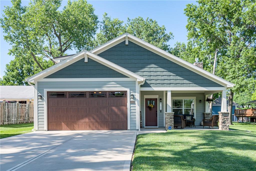 Welcome to Weatherby Lake living! Peacefully situated on a quiet, no-outlet street, this beautiful second-tier home offers lake views, lake privileges, a zero-step entry, fenced yard, two outdoor patios, and a spacious nearly ¾-acre lot—all with the ease of primarily main-level living.Three bedrooms and laundry are conveniently located on the main level, including a luxurious primary suite featuring a separate vanity and heated bathroom floor. The recently finished upstairs adds a fourth bedroom and flexible additional living space. Newer interior paint can be found throughout the home. Enjoy cozy evenings by the craftsman-style gas fireplace with beautiful lake views just beyond.An extra-deep tandem garage provides room for a third vehicle, additional storage, or lake gear, while a second driveway offers even more convenient parking. This home has been meticulously maintained inside and out and includes central vac, a water softener, and a Rain Bird sprinkler system. Major systems and the roof have been professionally checked and serviced twice each year to help keep them in prime condition, and the trees have been continually maintained by a local tree-care professional. Additional updates include newer SW Emerald exterior paint, a newer dishwasher, newer water heater, gutter guards, and a matching Hardie board shed.Beyond the home, enjoy everything that makes Weatherby Lake such a special community. Residents have access to the Yacht Club, swim beach, parks and trails, tennis and pickleball courts, sand volleyball, basketball courts, playgrounds, a soccer field, outdoor concerts, Jr. Sailing, Fishing Club, Women of Weatherby, gardening and book clubs, ice skating, and a full calendar of seasonal events and holiday celebrations. Located within the award-winning Park Hill School District, this is an incredible opportunity to enjoy the Weatherby Lake lifestyle!