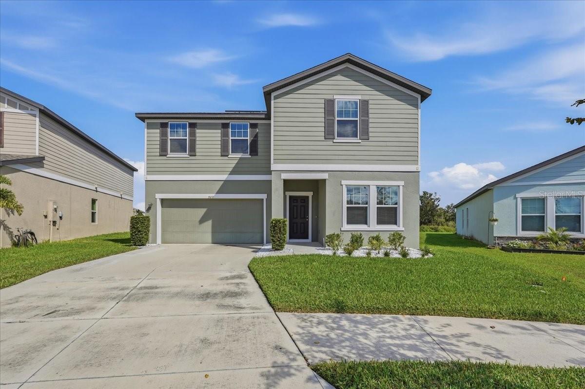 Welcome to Hidden Creek, a Zephyrhills community offering convenient access to Wesley Chapel’s shopping, dining, entertainment, and everyday essentials. Enjoy the benefits of energy efficiency with fully paid-off solar panels installed in 2023 - an excellent added value that can help lower ongoing home ownership costs from day one! Thoughtfully refreshed and ready for its next owner, this spacious two-story home combines a versatile floor plan with modern finishes and a beautiful natural backdrop. Inside, fresh interior paint, brand-new luxury vinyl plank flooring, and new bedroom carpeting create a clean, updated feel throughout. The kitchen serves as the heart of the home, featuring white shaker cabinetry accented by crown molding, an oversized island, and brand-new Samsung stainless steel appliances. Its open design connects effortlessly with the dining and living spaces, creating an inviting setting for everyday living and entertaining. The flexible layout includes a first-floor bedroom and full bathroom, ideal for overnight guests, extended family, or a private home office. There is also a front room that can be used as a den or office! Upstairs, four additional bedrooms provide plenty of room to spread out, complemented by an expansive loft that can easily accommodate a media room, game room, play area, or additional lounge space.The primary bedroom is spacious, featuring a private ensuite and an oversize walk-in-closet.  Out back, enjoy the added privacy of a large backyard overlooking a peaceful pond and conservation area, with no rear neighbors to interrupt the view. Whether enjoying a quiet morning outdoors or unwinding at the end of the day, the natural surroundings provide a welcome sense of tranquility. With five bedrooms, three full bathrooms, versatile living areas, fresh interior updates, and a desirable pond-and-conservation setting, this Hidden Creek home offers space, flexibility, and a convenient location! Zephyrhills provides a charming, small-town lifestyle & comes with delicious restaurants & the eclectic shops of Historic Downtown Zephyrhills. The Tampa Premium Outlets and The Shoppes at Wiregrass are also conveniently located nearby. You will love the convenience of living near major roadways including SR 54, HWY 301, and I75 which allow easy access to Tampa, Wesley Chapel, Lakeland, and Orlando. Hidden Creek residents enjoy amenities that include a tot lot, dog park, open-air cabana area and a community pool!