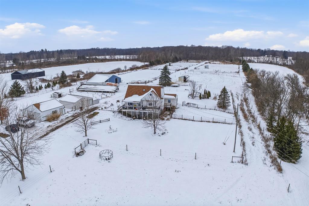 Set on 10 acres, this charming hobby farm is brimming with character! The inviting 1,664 sq ft home features 4 bedrooms and 2 full bathrooms, offering comfortable living spaces. The walkout basement adds valuable flexibility, with two partially finished rooms ideal for hobbies, a home office, or guest space plus a dedicated laundry area and ample storage. Equestrian and hobby farm enthusiasts will love the three outbuildings and 48 solar panels! Highlights include a detached 2-car garage; a 24'x24' hay barn with excellent storage for feed, equipment, or additional animals; and a versatile 45'x30' horse barn featuring two 10'x12' stalls (with room to add more), an 8'x12' tack room, and a 12'x12' feed room. This expansive 10.03-acre property is a horse lover's dream, boasting a generous 110'x330' outdoor arena. Four well-maintained pastures and four run-in sheds provide plenty of grazing space and shelter for the animals. This property seamlessly blends vintage charm withpractical equestrian amenities, creating a joyful country setting. WANT MORE INFO? Click the Virtual Tour link which has much more detailed information, an enhanced photo gallery and a property video! Do not go to the property without an appointment.