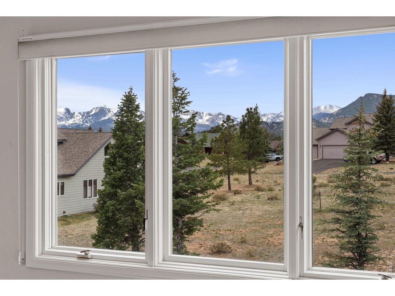 Experience elevated mountain living in this beautifully renovated Estes Park condo, offering the perfect blend of luxury, comfort, and convenience. Completely remodeled from top to bottom, this turn-key, lock-and-leave retreat features custom cabinetry, new LVP flooring throughout, a stunning all-new kitchen, and beautifully updated baths with thoughtful, modern finishes. Designed for easy main-level living, the open and airy floor plan is filled with natural light and framed by breathtaking mountain views in every direction. Cozy up by the living room fireplace or step outside to the private deck with retractable awning, where you can take in incredible views of Longs Peak and Mount Meeker. The versatile loft adds additional living or guest space, perfect for hosting friends and family after a day of exploring the mountains. Ideally located near Lake Estes, downtown Estes Park, and Rocky Mountain National Park, this home offers unmatched access to hiking, dining, shopping, and outdoor adventure while still feeling like a peaceful mountain escape. Whether you're looking for a full-time residence, weekend getaway, or low-maintenance mountain retreat, this exceptional condo delivers luxury mountain living at its finest.