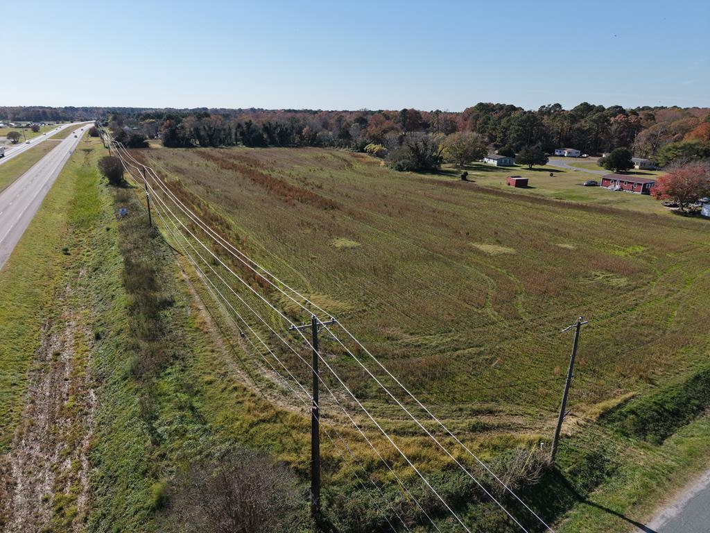 This 10.86-acre parcel on Captain Howe Lane in Eastville, VA, offers incredible potential for commercial or real estate development. Located directly on the highway, it enjoys high visibility and easy access, ideal for businesses, retail, or mixed-use projects. The flat, open land provides flexibility for commercial, residential, or agricultural uses. With Eastville's growing appeal, this property is a prime opportunity for developers or investors. Whether you're building a commercial hub or planning residential units, this rare find offers limitless possibilities. Don't miss out-contact us today to explore your options!