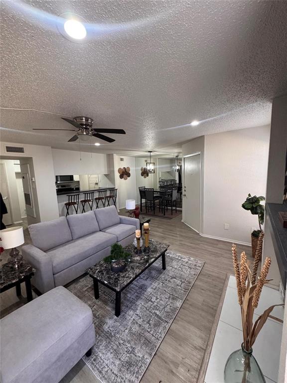 Charming First-Floor Condo in Richardson ISD

This lovely one-bedroom, one-bath condo is situated in the highly desirable Richardson ISD. Featuring updated LUX vinyl flooring throughout, designer fixtures, chrome hardware, LED canned lighting, ceiling fans, and fresh paint, this home offers both style and comfort. The mirrored dining area flows seamlessly into a bright living room with a cozy fireplace and large windows that fill the space with natural light.

The kitchen is equipped with an updated dishwasher, cooktop oven, and microwave, while the spacious laundry room provides ample storage. Enjoy a privately fenced patio with a generous storage area, perfect for outdoor relaxation. Covered parking (Space 2H) adds convenience.

With access to three on-site pools and a tennis court, this condo is a fantastic place to call home. Don't miss this opportunity!