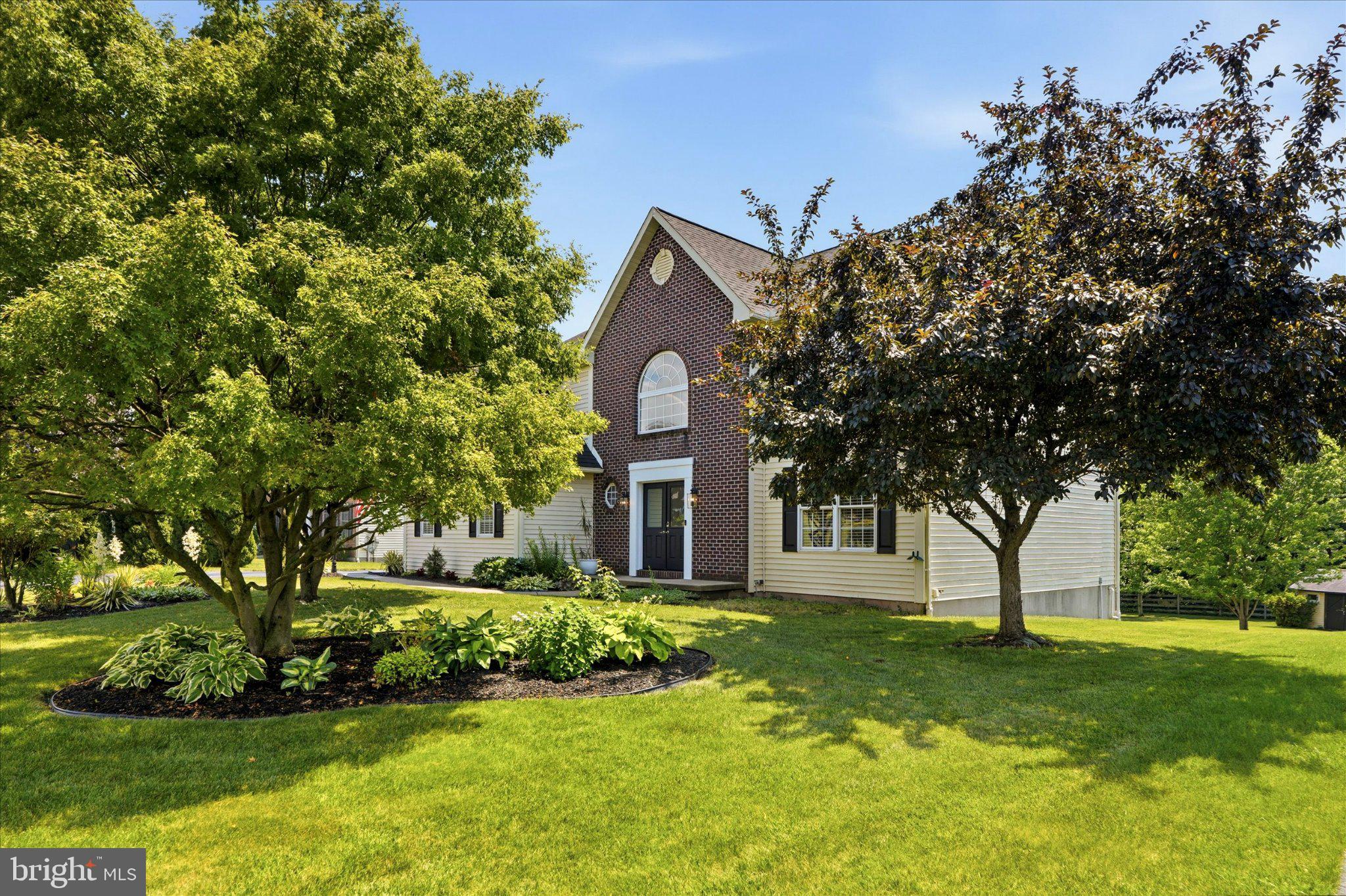 Do not wait any further—this home truly has it all. Welcome to 604 Farmingdale Drive in the desirable Wood’s Edge community. The beautifully landscaped front yard features a newly sealed driveway and a two‑car garage. This exceptional lot offers a serene backyard retreat overlooking a small farm and is just a short walk to community walking paths, pickleball/tennis courts, soccer field, two playgrounds, and a basketball court.This Malvern III model, built in 2003 by Grande Construction Co., offers 2,700 sq. ft. above grade plus 1,100 sq. ft. of finished basement space. The home includes 4 bedrooms and 3.5 baths and is known for its spacious layout and timeless design. The impressive two‑story foyer features a Palladian window filling the space with natural light and highlighting the soaring 17‑ft ceiling. During construction, the homeowners selected several upgrades including a curved staircase, second‑floor laundry, Super Seal Insulation Package, and the Christmas Light Package with a dedicated switch controlling the front‑facing window outlets. A brand‑new foyer chandelier has also been installed.To the right of the foyer is a private office/sitting room that can also serve as a main‑level bedroom. All windows are tilt‑in for easy cleaning, and the homeowners added brand‑new blind window treatments on both the first and second floors. Continue to the eat‑in kitchen with kitchenette area, opening to a roomy family room featuring brand‑new carpet and a stone‑accented gas fireplace. Adjacent is a dining room with wainscoting, tray ceiling, new carpet, and a new chandelier.Upstairs are three spacious bedrooms plus a large primary suite with vaulted ceilings, private ensuite, and a versatile sitting room ideal for an office or reading nook. The suite includes a walk‑in closet and full bath with shower, double vanity, and large jacuzzi tub. The second floor also includes a laundry closet with washer/dryer, an additional full bathroom, and pull‑down stairs in the end bedroom with partially floored attic storage. All bedrooms feature large, lighted closets, and all bedroom and hallway light fixtures have been updated. Additional upgrade: whole‑house fan on the second floor.The finished basement offers exceptional additional living space, including a second family room, three large flex areas suitable for an in‑law suite, a full bathroom, and a custom bar with cabinetry and mini‑fridge (included), pre‑plumbed for a sink. A corkboard conceals the main water line access panel. A nearby closet houses the Garber water softener system, salt container, and sewage ejector pump. The rear room includes two windows, a closet with the updated HVAC system (York, 2021), and an updated water heater (Rheem, 2019). A condensate line drains into the sump pump for added protection. A second closet contains the electrical panel and large cabinet (included). Additional upgrade: whole‑house humidifier attached to HVAC. A large additional room offers endless possibilities for a playroom, craft room, or extra living space. Two exterior doors lead to the backyard. A switch near the double doors controls the backyard spotlight with two recessed integrated LED motion‑sensor lights and power to the shed, which includes interior and exterior receptacles.Major update: new roof installed in 2021. Radon detectors located in basement and second floor.Wood’s Edge is not an HOA but part of the Wood’s Edge Trust with a required membership of only $210/year. Additional features include a two‑car garage with a custom carpenter workspace; garage refrigerator included. Located in Daniel Boone School District with convenient access to shopping, major commuter routes, Hershey, Harrisburg, Lehigh Valley Hospital (6 miles), King of Prussia (30–40 min), Philadelphia Premium Outlets (12 miles), Philadelphia Airport (1 hour), Lancaster (35–40 min), and Reading (25 min).