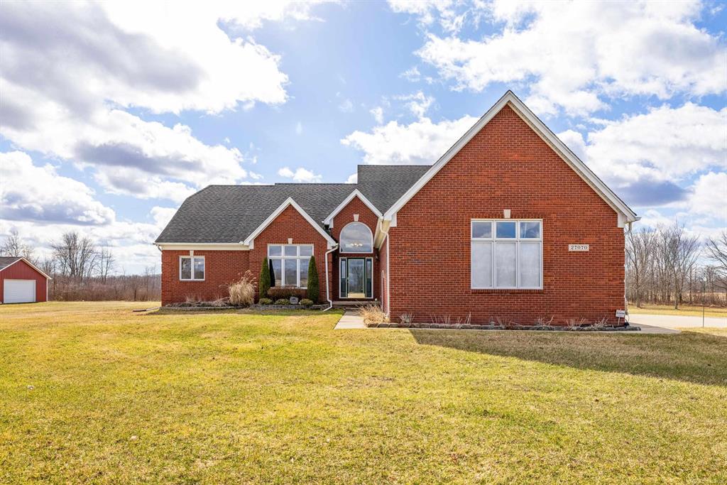 Nestled on a serene and private 15.32-acre property with hunting rights, this beautiful split-level brick home offers the perfect blend of comfort, character, and peaceful country living. Set far back off the road, the home provides exceptional privacy with virtually no traffic noise, creating a truly tranquil setting. Inside, you'll fall in love with the stunning vaulted ceilings accented by skylights, along with elegant arched and stained-glass windows that fill the home with natural light and charm. The stylish kitchen features granite countertops, a tray ceiling, and a cozy eat-in dining area, while a separate formal dining room provides the perfect space for gatherings and entertaining. The first-floor primary suite offers convenience and comfort with a spacious full bath and walk-in closet. Downstairs, the massive basement-already plumbed for a bathroom-offers endless possibilities to finish into your dream space, whether it's a recreation room, home gym, or additional living area. Outside, a large pole barn provides the perfect setup for a mechanic's garage, workshop, or hobby space, offering plenty of room for tools, equipment, and projects. Surrounded by beautiful acreage and nature, this property is a rare opportunity to enjoy privacy, space, and the outdoors while still having a warm and welcoming place to call home.