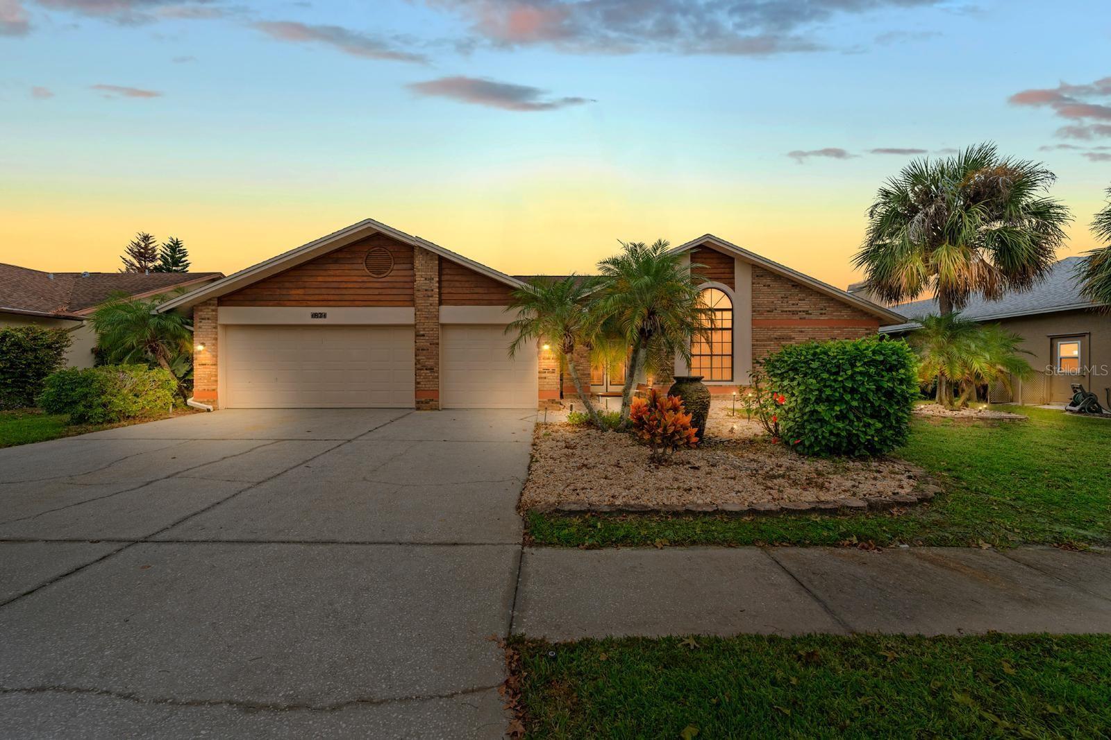 Elegant 5BR/3BA/3CG POOL residence in the sought-after Boot Ranch – Eagle Ridge community. This refined home offers soaring ceilings, an expansive open-concept design, and beautifully appointed interiors with stone countertops and generous living spaces ideal for upscale living and entertaining. The sought-after split layout provides privacy, flexibility, and multiple options for guest suites or executive home offices.
Enjoy resort-style outdoor living on the spacious screened lanai, complete with a sparkling pool and covered seating areas. Additional highlights include a full-size laundry room with custom storage, well-proportioned bedrooms, and a three-car garage for optimal convenience.
Located in one of Palm Harbor’s premier neighborhoods, known for A-rated schools, proximity to Lake Tarpon, scenic parks, golf courses, fine dining, and boutique shopping. Centrally positioned with easy access to Tampa, the Gulf Beaches, and top regional amenities. A rare opportunity to own a luxury pool home in a highly coveted location.