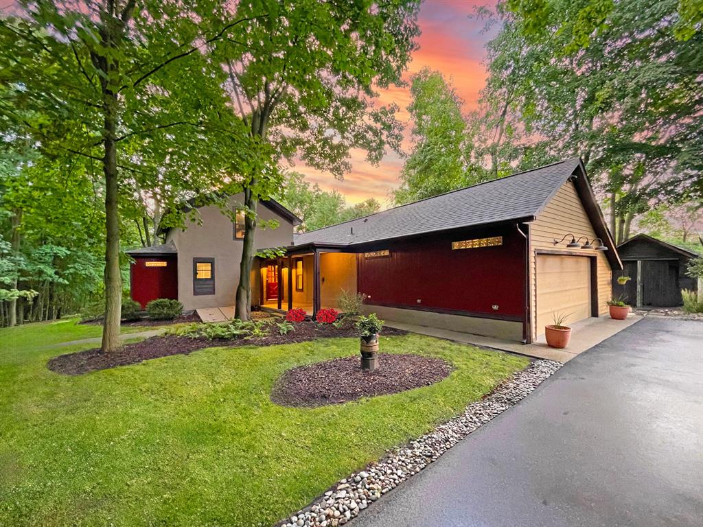 This charming historic home in Matthaei Farm offers a rare blend of character, modern updates, and a prime location--perfect for those seeking proximity to the University of Michigan and local hospitals. As one of the original homes in this preservation-focused neighborhood, it boasts stunning natural beauty and serene views. Watch breathtaking sunsets from the deck overlooking the valley and pond. Inside, original wood beams, three sets of patio doors, and a remodeled kitchen with farmhouse charm enhance the inviting living space. The first-floor primary suite features a walk-in closet and spa-like bath, while a vaulted office provides a picturesque workspace. A second bedroom, mudroom, and laundry complete the main floor. Upstairs, a private third bedroom suite offers added flexibility.Enjoy access to The Pond House, swimming ponds, tennis courts, and scenic trails, all just minutes from U-M's campus, medical facilities, and downtown Ann Arbor. Explore more: http://tours.mixedmediaco.com/ue/BgnVW