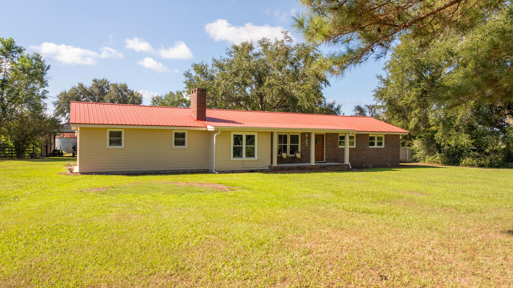 Country living with room to spread out! This 4-bedroom, 3-bath home offers a great combination of comfortable living space, outdoor amenities, and usable acreage. Inside has been completely renovated. You'll find a bright, inviting interior with updated flooring, fresh neutral finishes, multiple living areas, and a spacious kitchen featuring abundant cabinetry, generous counter space, brand-new stainless steel appliances, and an adjoining dining area. A large brick fireplace adds warmth and character to the family room, while the additional living space provides plenty of flexibility for entertaining or everyday life. Outside is where this property really shines, with a fenced backyard, above-ground pool and deck ready for summertime fun, an attached two-car garage, and plenty of open space surrounding the home. Beyond the backyard, the property opens into beautiful pastureland bordered by mature trees and includes A barn and covered storage areas with plenty of possibilities for equipment, livestock, hobbies, or recreational use. With wide-open views, established pasture, mature shade trees, and the space to enjoy a quieter country lifestyle, this property offers much more than just a home. Schedule your private showing and come see everything this unique property has to offer!