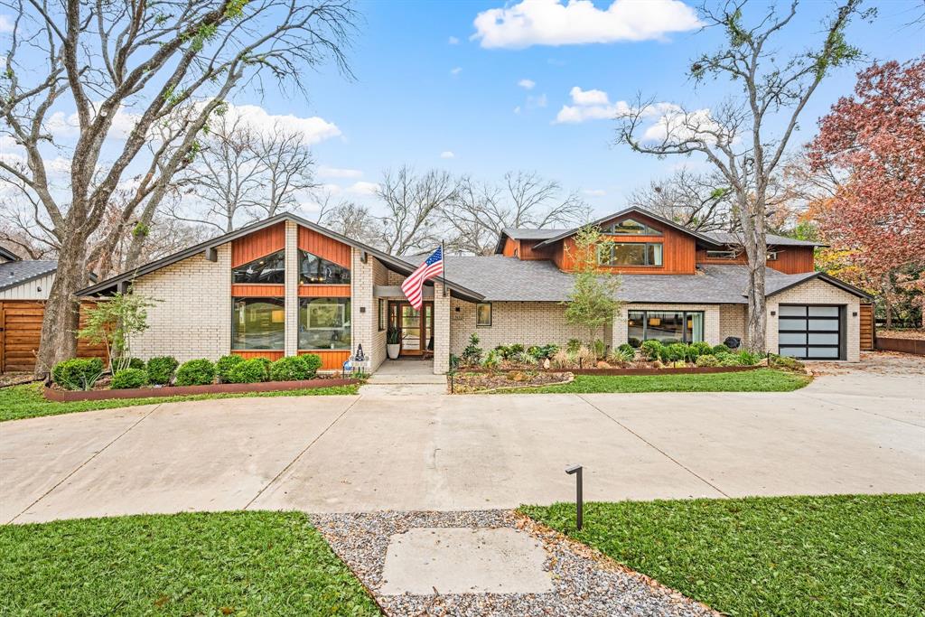 Set on one of the most coveted streets in the area, this beautifully updated residence offers a rare combination of space, style, and setting. Situated on nearly half an acre backing to a serene, heavily treed creek, the home is zoned to one of the area’s top-rated elementary schools and delivers exceptional indoor-outdoor living. The thoughtfully updated interior features 5 spacious bedrooms, 4 full baths, 2 half baths, and a 3-car garage. Modern lighting and advanced light-control systems enhance the home throughout, while electronic blackout shades and a dedicated home theater create an ideal environment for comfort and entertainment. Expansive living spaces are filled with natural light, offering both elegance and functionality. The kitchen is a true centerpiece, featuring a large island overlooking the creek-side backyard, two side-by-side ranges providing 72” of cooking space, and plenty of refrigeration space. The oversized living area includes a full wall of glass framing picturesque views of the backyard, creek, and outdoor living areas. A perfectly placed utility room near the primary suite offers abundant storage and convenience. The primary suite is a private retreat with a spacious bedroom and the bathroom features a soaking tub, his-and-her vanities, and three separate closets. Upstairs, two additional bedrooms each have dedicated bathrooms, along with a half bath serving the living area and media room. The upstairs living space opens to a balcony overlooking the backyard deck and tranquil creek views. Outdoors, the property truly shines. A large deck hovers above the creek, creating a stunning setting for entertaining or peaceful evenings surrounded by nature. The turf backyard provides year-round beauty perfect for relaxation and entertaining. This is a rare opportunity to own a move-in-ready home on a premier creek lot in an unbeatable school district, seamlessly blending privacy, luxury, and timeless appeal in one exceptional address.