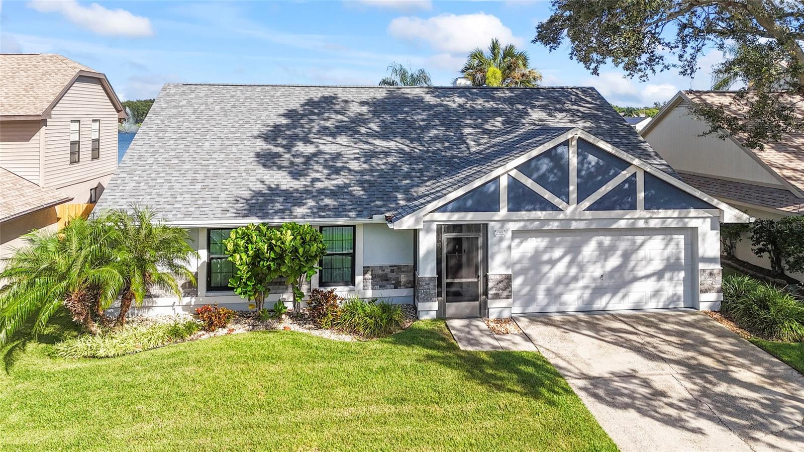 Under contract-accepting backup offers. Stunning Waterfront Pool Home in Brandon – A True Florida Oasis! Prepare to be impressed by this absolutely gorgeous 3-bedroom, 2-bath waterfront pool home in the heart of Brandon! From the moment you arrive, the impeccable curb appeal sets the tone with lush landscaping, a crisp, clean exterior, and eye-catching stacked stone accents.  Step inside through the elegant stained-glass front door and be welcomed by a beautifully detailed foyer featuring designer tile flooring, custom wall accents, and a modern, on-trend color palette. The living room is a showstopper with soaring vaulted ceilings, a cozy wood-burning fireplace, stunning wall treatments, and eye-catching herringbone tile flooring that adds depth and character.  For the chef in the family, the updated kitchen is a dream come true! Featuring 2016 Maytag stainless steel appliances, a sleek farmhouse-style sink, leathered granite countertops, and ample cabinetry and counter space, this kitchen is built for both functionality and style. Step outside to your private backyard oasis! The covered and screened lanai overlooks a serene saltwater pool, surrounded by lush tropical landscaping and tranquil waterfront views—a perfect setting to relax, entertain, and enjoy the best of Florida living.  The primary suite is pure luxury, complete with a romantic electric fireplace, double French doors leading to the yard, and a spa-like ensuite bathroom that feels like a private retreat.  Two spacious secondary bedrooms offer beautiful decorator paint colors and wall accents, while the second bathroom is equally stylish and well-appointed.  Notable Upgrades Include:  New Roof (2022), Impact Windows (2023), AC Unit (2016), Water Heater (2022), New Fence (2025), Lift Master Garage Door Opener with Camera (2023), Masonite Solid Core Interior Doors & Impact Rated Exterior Doors.  Conveniently located near Brandon Mall, I-75, Hwy. 301, Hwy. 60, Hwy. 41, whole home filtration system that is also a water softening system, and the Crosstown Expressway—this home offers quick access to shopping, dining, hospitals, MacDill Air Force Base, Tampa International Airport, and Downtown Tampa.  This home has it all—style, upgrades, location, and waterfront relaxation. Don’t miss your chance to own this exceptional Florida gem. Schedule your private showing today—you won’t be disappointed!