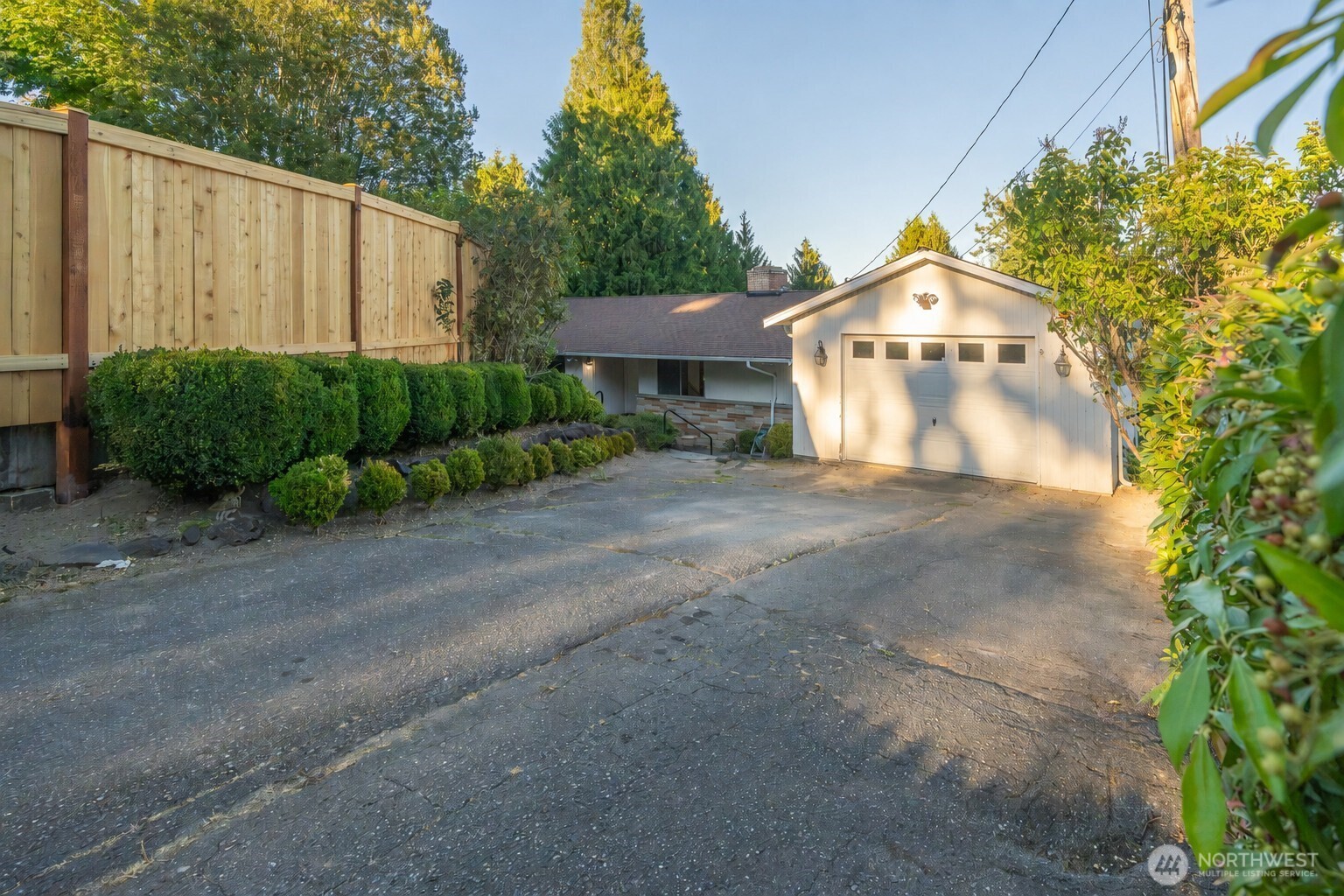 Midcentury character, a fantastic location, and room to make it your own and earn equity! 2,680 sf total with 1,640 finished, on 10,705 sf lot.  Clean and move-in ready, this 3-bedroom, 1.75-bath home offers an exciting opportunity to update, personalize, and build equity in a neighborhood of million-dollar + homes. House behind just sold in May for $1.154. Across the street, newer home, sold for $1.488 in 4 days! Set on a large, private lot with mature landscaping, the property enjoys a quiet, peaceful setting, a spacious yard, and a generous deck, perfect for relaxing or entertaining. The huge 1,340-square-foot daylight basement offers exceptional potential for additional living space, including room for another bedroom. Approximately 300 square feet has been refreshed with new carpet and paint and features a cozy fireplace. You’ll also find a large utility room and abundant storage downstairs. Detached large one-car garage. Professionally pre-inspected for added buyer confidence. Enjoy the distinctive Lake Forest Park lifestyle, known for its natural beauty, wooded surroundings, community parks, Lake Washington recreation, and access to the Burke-Gilman Trail...all at a bargain price! Bring your vision and transform this well-located home into something truly special!