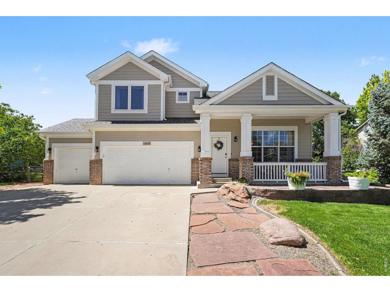 Welcome to this exceptional two-story residence offering 3,498 sq. ft, plus a finished basement, designed for comfort and everyday luxury in highly desired unincorporated Longmont. This amazing home features 5 bedrooms, a dedicated den/office, and 3.5 baths and very low monthly HOA fees (including irrigation water) and no Metro tax. Beautiful hardwood flooring flows through the entry, living, dining, and kitchen areas. Vehicle and hobby enthusiasts will love the rare 4-bay garage plus an additional workshop/gym space. The heart of the home is a chef's kitchen with hardwood cabinets, 42-inch uppers, double ovens, built-in gas cooktop, microwave, large island, and a built-in admin station. The grand entry impresses with cathedral ceilings and the family room dazzles with hardwood floors and a cozy gas fireplace. Unwind in the primary suite with vaulted ceilings, new blinds, a massive walk-in closet, and a newly remodeled ensuite with a double-head walk-in shower. Upstairs carpet was replaced in 2022, and top-quality crank windows were installed in 2019. The finished basement offers versatile living space with a second living room, bedroom, den, full bath, and fresh 2026 carpet. Step outside to a 1,000 sq. ft. private covered patio with three fans, overlooking a fully fenced yard with mature trees, a yard shed, and direct views of HOA-maintained green space. Mechanics and exterior updates provide total peace of mind: Class 4 roof (2024), high-capacity gutters (2024), exterior paint (2025), radon mitigation, and extra attic insulation. Tucked into a private neighborhood surrounded by farmland, you'll enjoy open spaces, a playground, basketball court, and easy access to the St. Vrain Trail System, all maintained with exceptional pride of ownership.