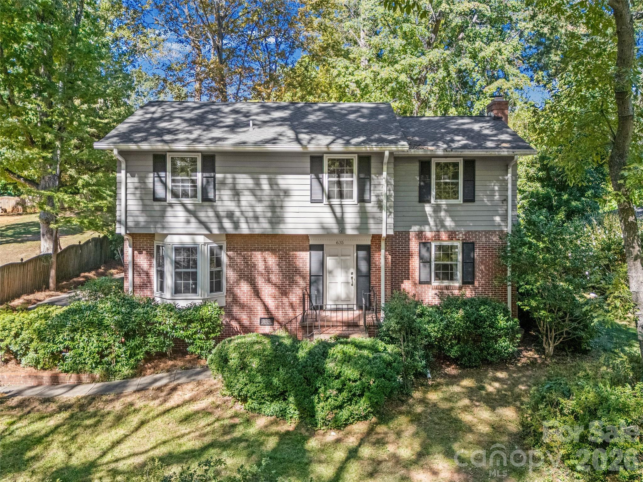 A home with personality instead of a cookie-cutter floor plan - this is one you won't want to miss! Nestled in the established Fewell Estates neighborhood of Rock Hill, this charming home offers over 2,200 square feet of living space, featuring 4 spacious bedrooms with generous closets and 2.5 baths.  Freshly painted with beautiful hardwood floors throughout!  The inviting living room features built-in bookcases and a cozy fireplace. A spacious eat-in kitchen and separate dining room provide plenty of room for everyday living and entertaining.  This home is filled with vintage charm and is priced with the opportunity for its next owner to make personal updates while preserving the character that makes it special. The yard has a history of beautiful spring blooms, offering wonderful potential for someone who enjoys gardening and outdoor spaces.  And the location is hard to beat - directly across from a park featuring disc golf, walking trails, a playground, and a pavilion, you'll have outdoor recreation just steps from your front door. Plus, you're conveniently located near Winthrop University, shopping, dining, and all that Rock Hill has to offer.  Homes with this much space, character, and potential don't come along every day. Come see the possibilities and imagine making it your own!