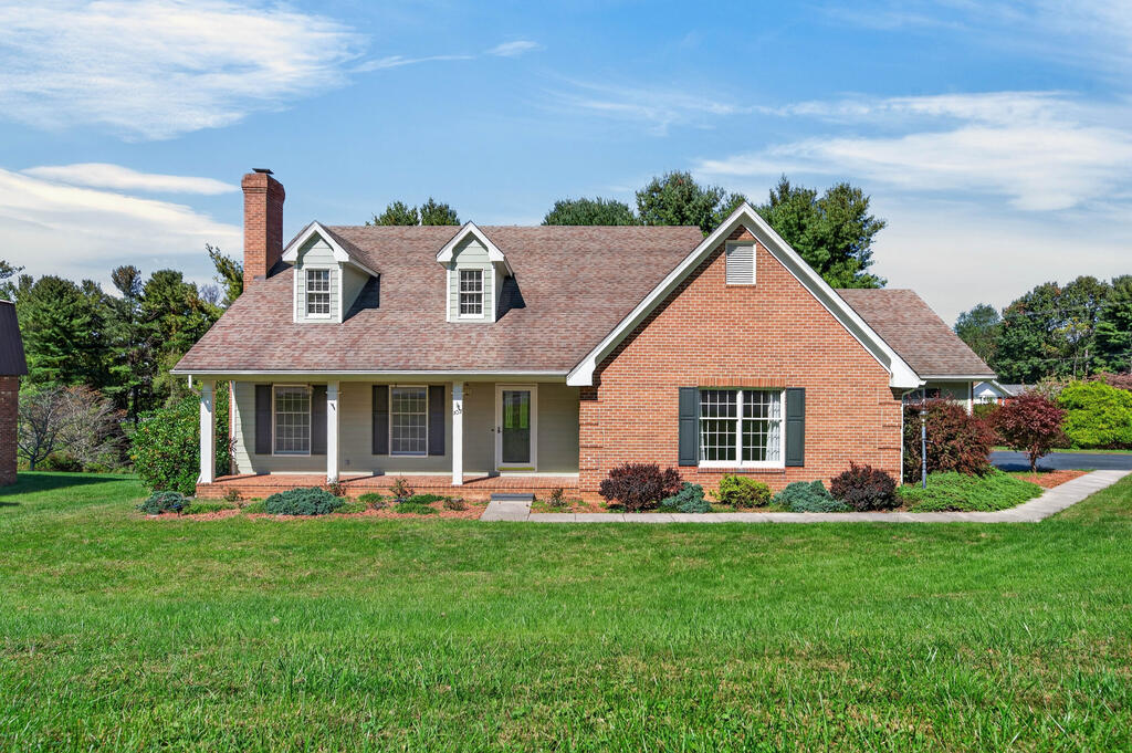 A home with presence, warmth, and room to enjoy life. Set in a well established Galax neighborhood, this stately brick home pairs timeless character with thoughtful updates. A kitchen facelift, fresh paint in most rooms, and a refreshed exterior give this classic a beautiful new chapter.  Inside, the spacious kitchen features granite countertops, tile flooring, and a breakfast room for everyday gatherings. The formal dining room sets the scene for holiday meals, while the living room's wood burning fireplace and decorative moldings bring an inviting elegance to evenings at home. A main level primary bedroom with generous closet space offers everyday convenience. Upstairs, three additional bedrooms and a bonus room provide flexibility for guests, hobbies, or working from home. A dedicated laundry room, central heating and air, and a two car garage add practical comfort.  Start your morning on the covered front porch or unwind on the covered back deck. The newly fenced backyard gives your pets space to enjoy the outdoors and creates a welcoming setting for relaxing or entertaining.  Life in Galax brings the charm of a mountain town with the conveniences you want close by: shopping, dining, schools, Twin County Regional Hospital, and a lively downtown filled with local shops, music, and community events. Walk or bike the New River Trail, enjoy performances at the historic Rex Theater, or head to the nearby Blue Ridge Parkway for a scenic afternoon.  Mount Airy is about 40 minutes away, Winston-Salem and Blacksburg about 1 hour 15 minutes, Greensboro and Roanoke about 1 hour 40 minutes, and Charlotte approximately 2 hours, depending on route and traffic. Enjoy the slower pace without losing your connection to city shopping, dining, and airports.  Classic style, fresh updates, and a setting that feels like home. Come see how beautifully your next chapter could fit here.