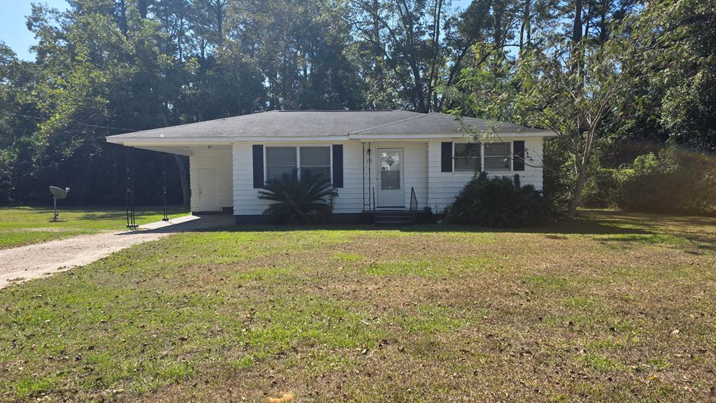 Charming opportunity with this 3-bedroom, 1-bath home.  Hardwood floors throughout, the spacious interiors offer a warm and inviting ambiance perfect for both entertaining and cozy family nights. The living room provides ample space for gatherings. A convenient carport offers additional protection from the elements while ensuring easy access into your home. Though requiring some renovation, this property presents an incredible canvas to create your dream abode or an excellent investment opportunity. Imagine transforming these classic bones into a modern masterpiece tailored to your taste! Ask about a FHA 203k home loan to get the upgrades you want done. Situated in an established neighborhood known for its friendly community atmosphere, you're just minutes away from Thomasville's vibrant downtown with its charming shops and local eateries. Don't miss out on making this diamond-in-the-rough your own — unlock endless possibilities with this well-located treasure in the heart of Georgia's rose city!