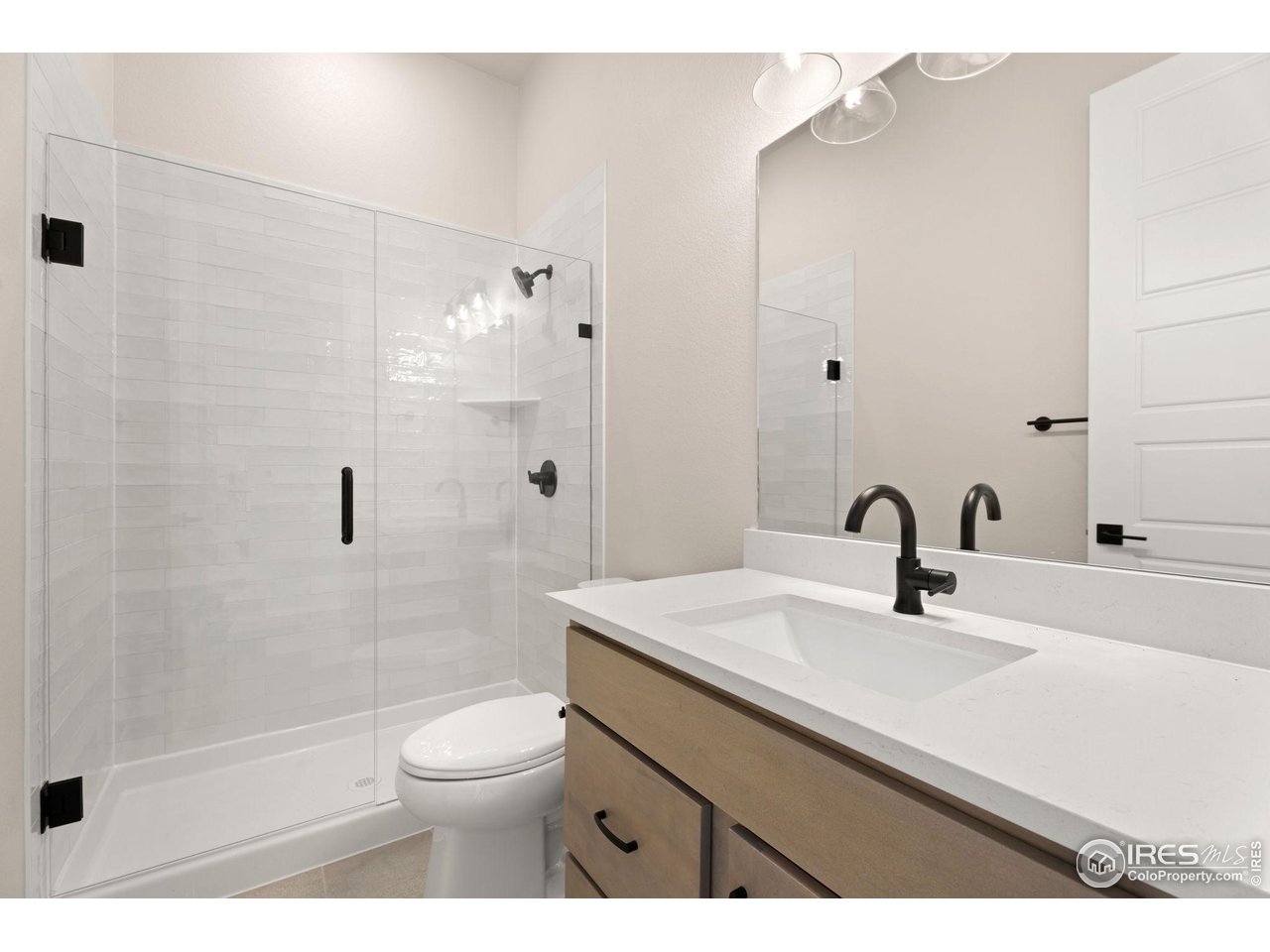 Builder Incentive of up to 6% when using preferred lender could provide approx. $47K towards allowable closing costs/prepaids and rate buy down. This can save you hundreds of dollars each month! Plan 2 at Festival at RainDance by Trumark Homes is a contemporary single-story home offering 2,230 Sq. Ft. of living space with three bedrooms and two and a half baths - a great location; walk-out basement backing to open space and community trail! The home features an inviting porch with secondary bedrooms and office just through the entrance hall. Beyond the entry you'll enter the gourmet kitchen featuring a spacious walk-in pantry and a center preparation island. This island includes a deep, single bowl composite sink that overlooks the dining and great rooms, complete with a modern gas fireplace. The kitchen features "Moonlight" stained Shaker style cabinetry, Carrara Marmi quartz countertops with tile backsplash, stainless steel appliance package with 5-burner gas cooktop, convection oven, built-in microwave, and dishwasher. The great room and dining room open to the covered outdoor room. The primary suite, located just off the great room offers a stunning, spa-like bathroom with a walk-in shower and an inviting freestanding tub. An expansive walk-in closet completes the primary suite. This beautiful home will be move in ready, complete with full yard landscaping and fencing. Neighborhood amenities of walking trails, orchards, non-potable water and trash, are included in your metro district fees. Membership to the Raindance pool is optional and currently $510/year; there are also other membership options combining amenities in Raindance and nearby Water Valley - "WaterDance"!