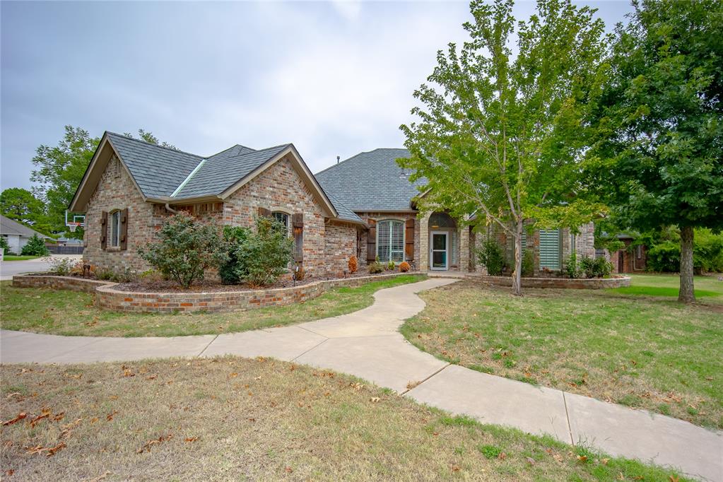 This beautiful 4-bedroom, 3.5-bath home with a dedicated office, safe room closet, and 3-car garage is situated on a spacious corner lot.  The open floor plan creates a warm and inviting main living space, complete with two dining areas and a cozy fireplace. The spacious kitchen has a large walk-in pantry, two ovens, and a built-in pellet ice maker.The dedicated office features an abundance of built-in cabinetry, making it ideal for working from home, studying, or even a home library.  It’s large enough to be used as a 5th bedroom if needed.  A safe room closet just off the main living area provides an added layer of security and peace of mind.  The laundry room includes a sink with sprayer for added convenience.The spacious primary bath offers a double vanity, relaxing soaker tub, separate walk-in shower, and the added luxury of two walk-in closets for exceptional storage.  A private door from the primary bedroom provides convenient access to the back patio.Out back you’ll find a heated saltwater pool with a beautiful fountain, hot tub, outdoor gas fire pit, and dedicated seating area.  Recent improvements include a new roof in 2025, new hot tub in 2025, and a new pool liner in 2026.