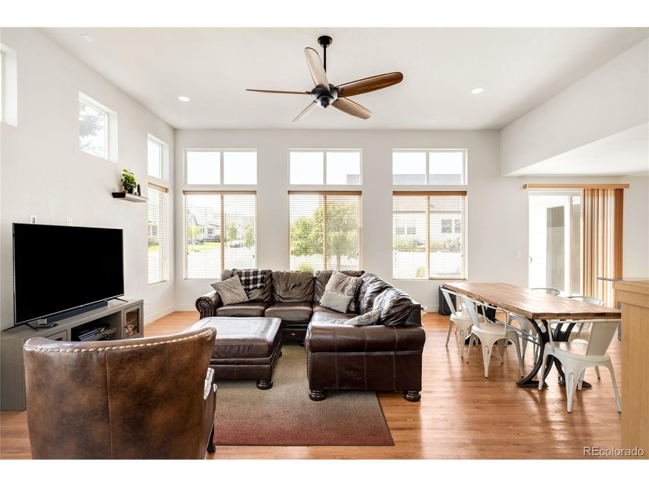Step inside and prepare to fall in love. Designed for effortless living and unforgettable entertaining, this exceptional home unfolds into a spectacular open-concept gathering space where the kitchen, dining room and living room flow seamlessly together. Just beyond, a glorious sunroom wrapped in natural light creates a showstopping extension of the home, perfect for morning coffee, lively celebrations or peaceful evenings overlooking the backyard.Upstairs, three spacious bedrooms include an extraordinary primary retreat with impressive proportions and a magazine-worthy en suite bathroom that feels like a private luxury spa. The beautifully finished basement offers even more room to gather, unwind or host overnight guests, complete with an additional bedroom, full bathroom and generous entertainment area.Outside, the backyard is nothing short of a masterpiece. Intricate rockwork winds through the landscape like a riverbed, creating a striking, one-of-a-kind setting that feels both artistic and serene. This is more than a backyard-it is an experience.Located in sought-after Brighton Crossing, residents enjoy access to the 7,000-square-foot Venture Center, fitness facilities, two community pools, parks, trails and sports fields. Barr Lake State Park, Downtown Brighton, Prairie Center shopping and dining, Brighton Oasis Family Aquatic Park and Riverdale Regional Park are all conveniently nearby.Spacious, dramatic and completely unforgettable, this is the kind of home that makes everyday living feel extraordinary.