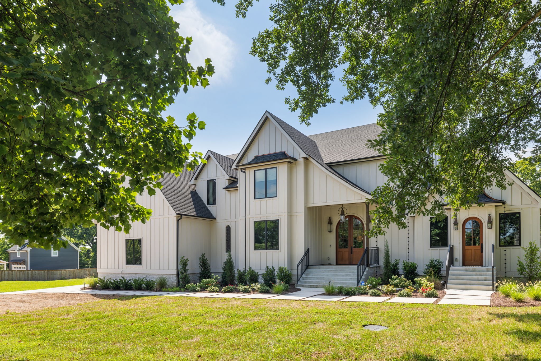 Sellers being called back to the office and relocating for work. Theyve loved this home and are devastated to leave it and East Nash.Allow yourself a moment of wonder mixed with awe at the sight of it: a unique yet perfect blend of comfort, convenience, state-of-the-art tech, & luxury aesthetics all brought together in this one-of-a-kind Mediterranean-style 5bed/6.5bath, 8,000+ sqft designer home. The curb appeal alone is remarkable as the arched Mahogany front doors flanked by wrought iron railing & lit by 3 gas torches combine to make a powerful statement. Indoors, the main level features a central foyer, access to the upper/lower levels, & opulent shared living spaces including a great room, cozy living room, formal dining, stunning kitchen, dedicated laundry, half-bath, & a private home office/study. An opulent primary suite awaits on the upper level, featuring a private bath ensuite & a reading nook. Enjoy Watermark fixtures, Taj Mahal countertops, a microcement shower, a soak/spa tub, & a private walk-in closet with laundry hookups. The upper level also has 3 guest bedrooms (all with walk-in closets) & 2 additional bathrooms. Special features include a custom marble sink & vanity imported from Türkiye & antique French doors dating back to the 18th century. A unique add-on unlike anything else in Nashville, this home features a dedicated apartment attached to the side, with private entry at the front & private yard access at the back. Perfect for in-laws, long-term guests, or an au pair, this add-on boasts a full kitchen accented by Zellige tile backsplashes, plus a greeting area, laundry, bedroom, & full bath. Opportunities abound on one of the largest parcels in this coveted Inglewood/East Nashville neighborhood. At just under an acre, the property boasts overflow parking, 4 attached garage bays, a full-home generator, & a huge fenced backyard with pool/guest house, Luxe chicken coop, & plenty of yard space for a swimming pool, gardens, toys, playsets & more.