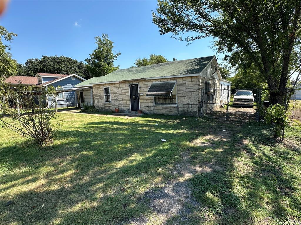 Your rehab project. 3 Bedrooms, 2 full baths. Large lot. Almost a third-acre lot per tax.