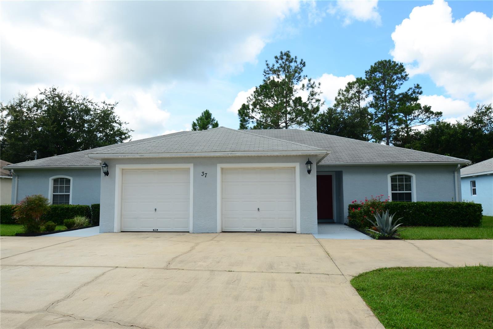 Adorable duplex! Over 1200 sq ft. Screened-in lanai, 3-Bed, 2-Bath, 1-Car Garage located in desirable Cypress Knolls neighborhood in the heart of Palm Coast. Perfect for a couple or small family. All bedrooms are spacious. Tile and carpet flooring. Lovely kitchen, loaded with plenty of cabinets and counter space. Great location! Nearby: walking and biking paths, Cypress Knoll Golf and Country Club, shopping, dining, convenience of I-95 and just minutes to the beach!