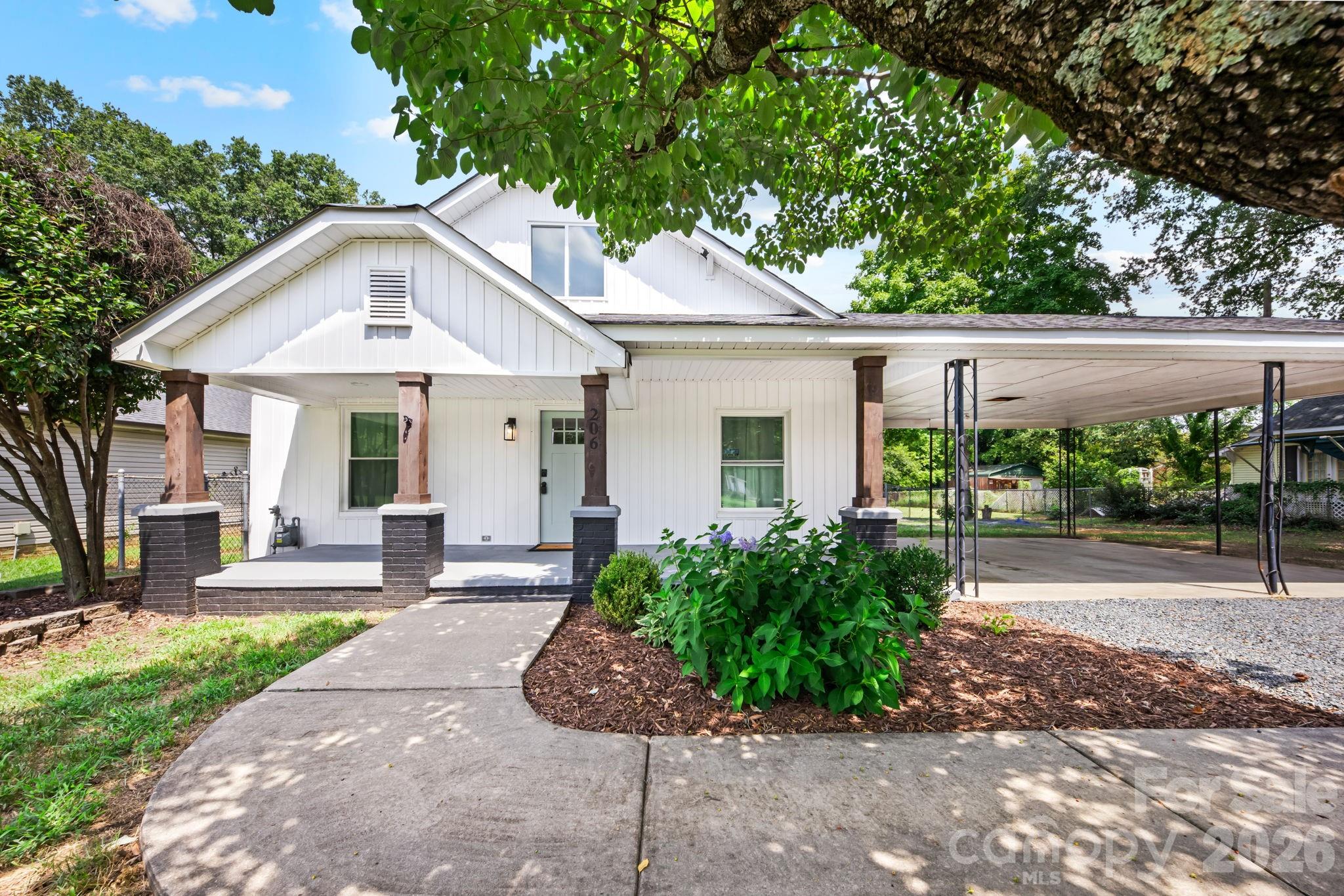 This charming 2-bedroom, 1-bath updated home is perfectly situated on a spacious lot just minutes from the heart of downtown Kannapolis! Step inside to a bright, open floor plan with modern updates and an inviting layout designed for both everyday living and entertaining. The impressive kitchen features a large center island, modern finishes, and appliances installed in 2024, creating the perfect gathering space for guest. The beautifully updated bathroom offers a freestanding garden tub, separate walk-in shower, stylish vanity, and updated fixtures.Outside, enjoy the large front porch—perfect for morning coffee or relaxing evenings—and a new back patio ready for grilling and entertaining. The expansive lot provides plenty of room for gatherings, outdoor activities, gardening, or creating your own backyard retreat. The LARGE finished attic adds even more versatility, with space that could be used as an office, bonus room, playroom, or additional storage.Additional major updates include a gas pack heating and cooling system installed in 2025 and a tankless water heater installed in 2024. With its combination of modern updates, flexible living space, fantastic outdoor areas, and convenient location near downtown Kannapolis, this home is truly a must-see!