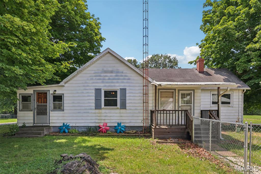 RETREAT and enjoy the quiet life in this 2 bedroom, 1 bathroom home on over half an acre. Everything you need on one level, including laundry! Home features a large bathroom, an open kitchen/dining room, and a large living room. Additional bonus room could be used as a third bedroom or a recreation room! Outside you'll find some fencing for furry friends, and a large outbuilding that has room to park multiple vehicles or tractors and have workshop space. Great location, great price. Home is being sold as is. Call your favorite realtor and take a look today!