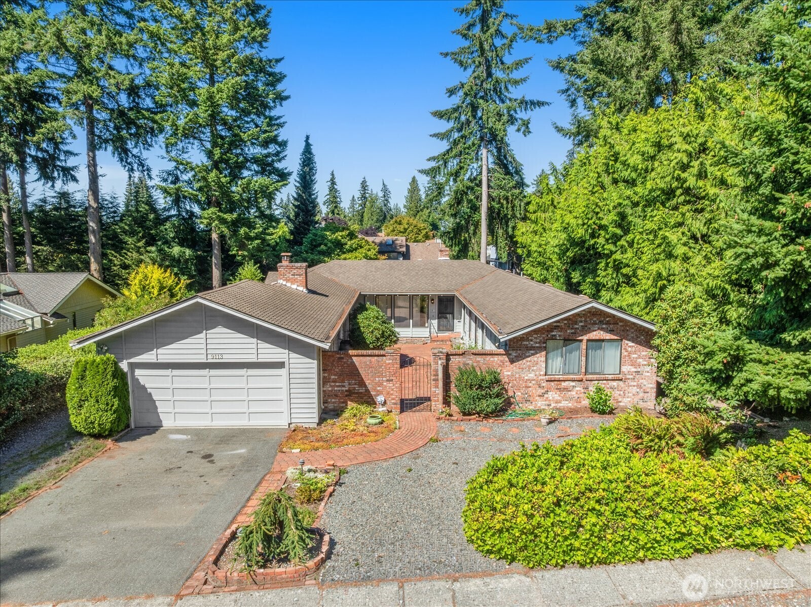 Welcome home to Seaview—one of Edmonds most beloved neighborhoods, where generous lots, mature landscaping, & a true sense of community make everyday life feel a little richer. This classic mid-century 4-bed rambler sits on an oversized 13,000+ square foot level lot and offers the kind of space, character, and bones that are increasingly rare at any price point. From the moment you arrive, the charming brick courtyard entry sets a warm, welcoming tone. Step inside to a natural stone entryway that opens into a home filled with warmth and character—original hardwoods in excellent condition under carpet throughout, two cozy wood-burning fireplaces, formal dining room, dedicated family room, & living room that together create a layout perfectly suited for both everyday living and memorable entertaining. 4 generous bedrooms offer room for the whole household to spread out comfortably while providing flexibility for a dedicated office if desired. Don't miss the huge unfinished basement for your workshop, toys, or to massively increase the finished footage. Outside, the deck and oversized, level lot provide a canvas for outdoor living, gardening, or simply enjoying the PNW seasons. Location couldn't be more ideal — minutes from the charming Edmonds bowl, waterfront dining, ferry terminal, boutique shopping, as well as all the everyday convenience that Lynnwood has to offer. Homes with this much space, character, and location don't come available often. Pre-inspection attached.